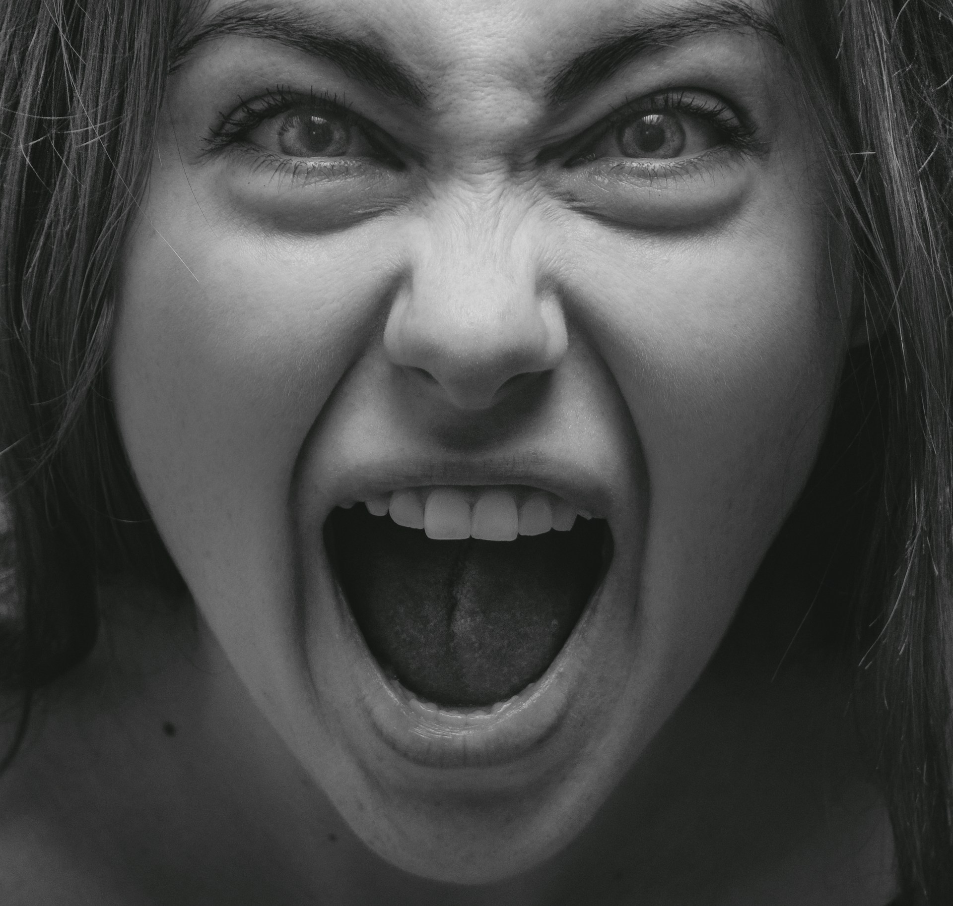 A woman speaking angrily | Source: Unsplash