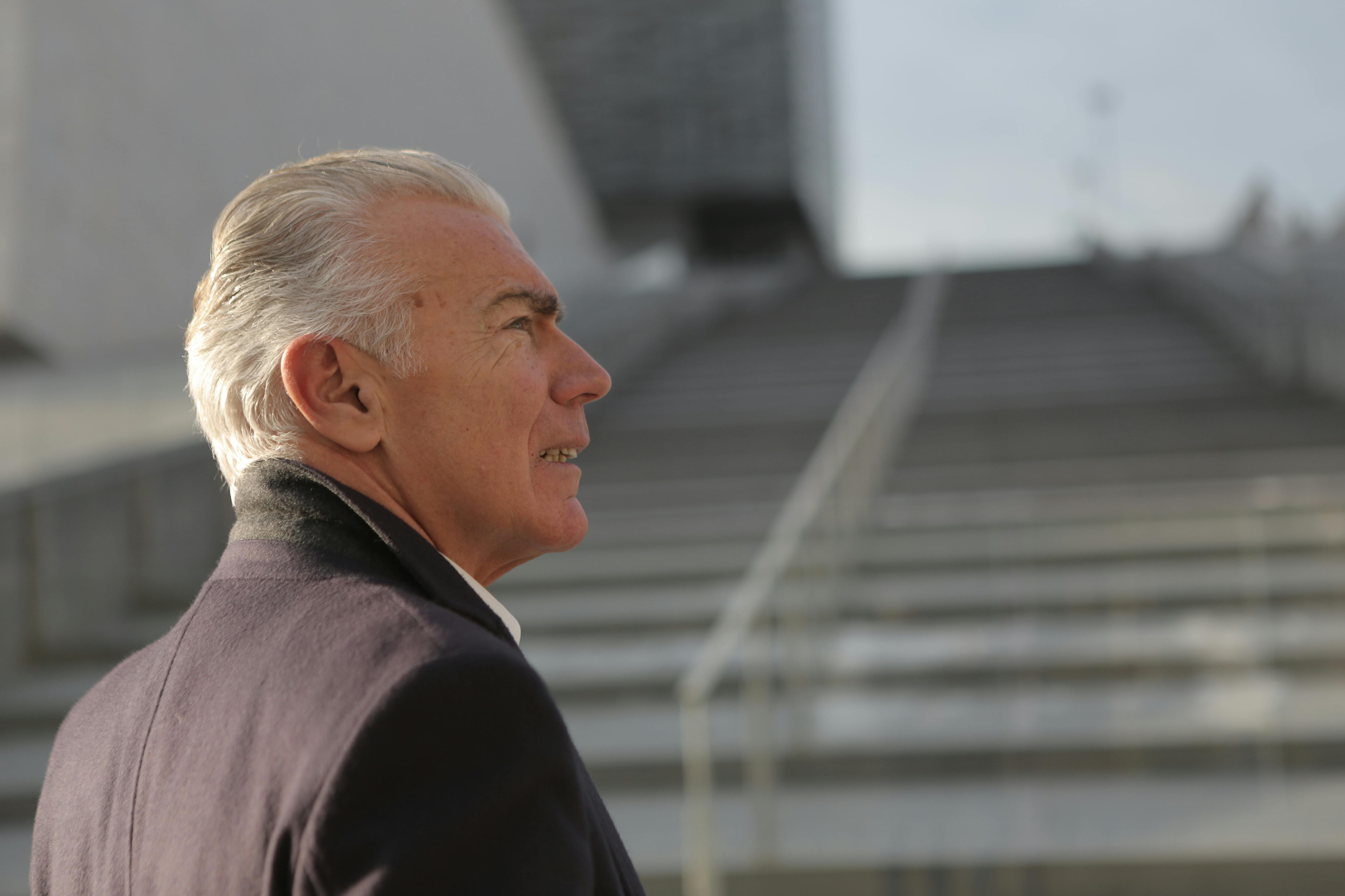 Elderly man standing near a staircase | Source: Pexels