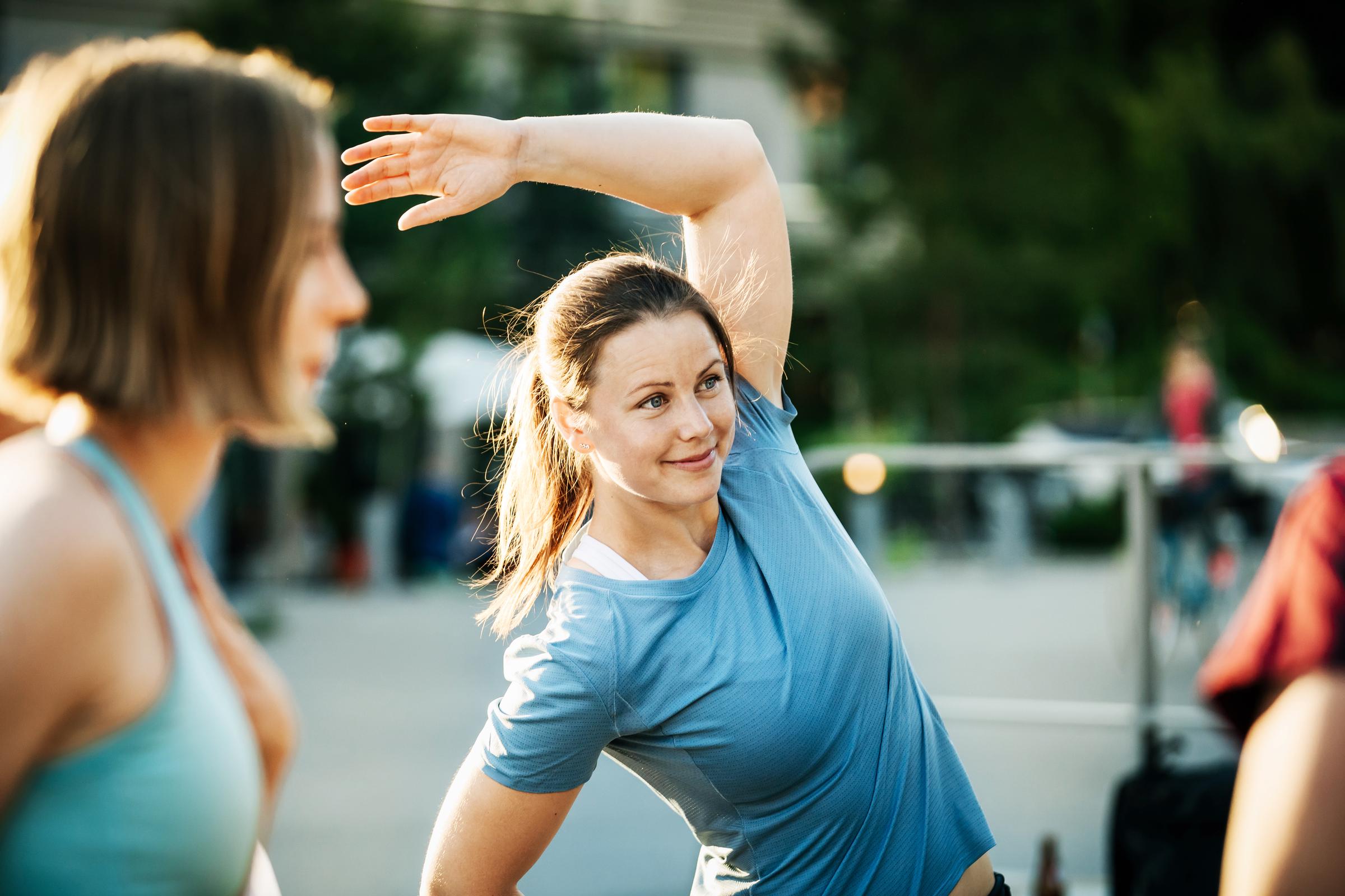 A woman warming up before going for a run | Source: Getty Images