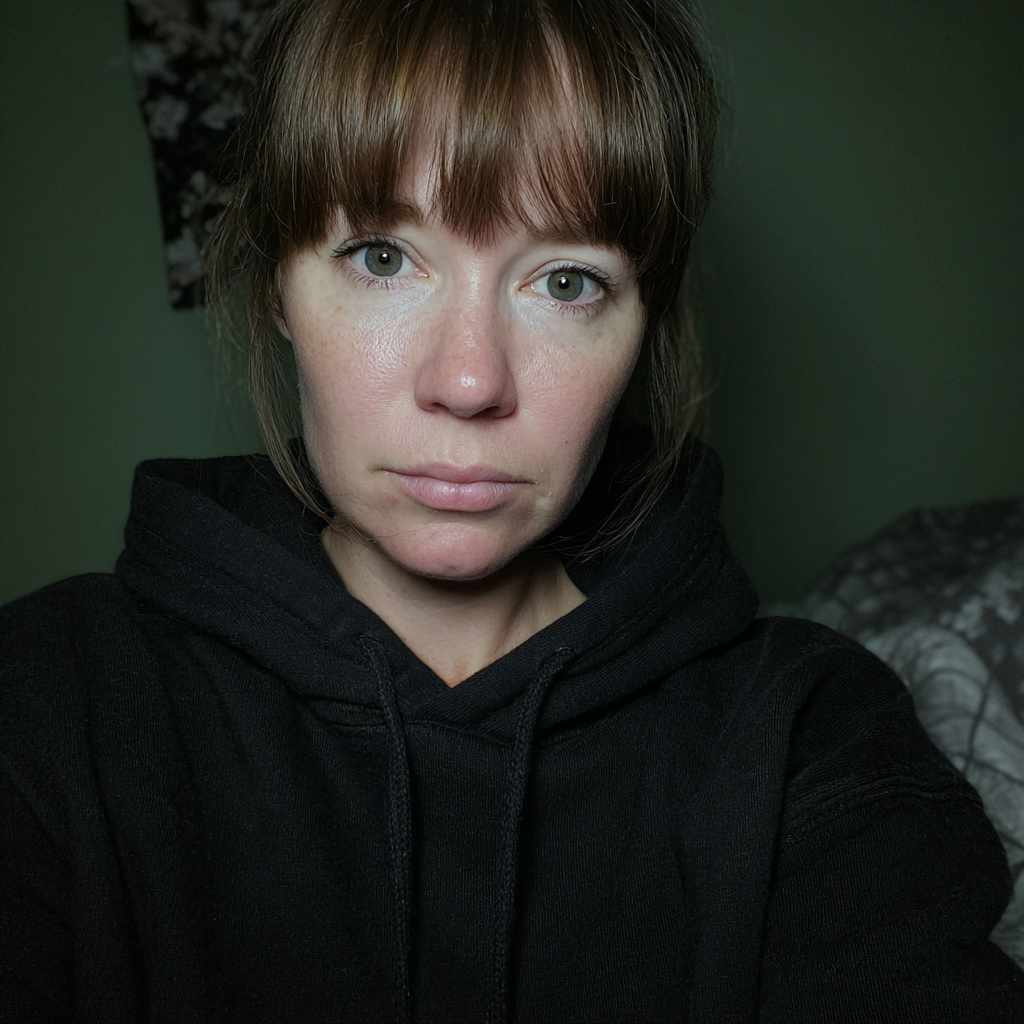 A woman wearing a black hoodie | Source: no source