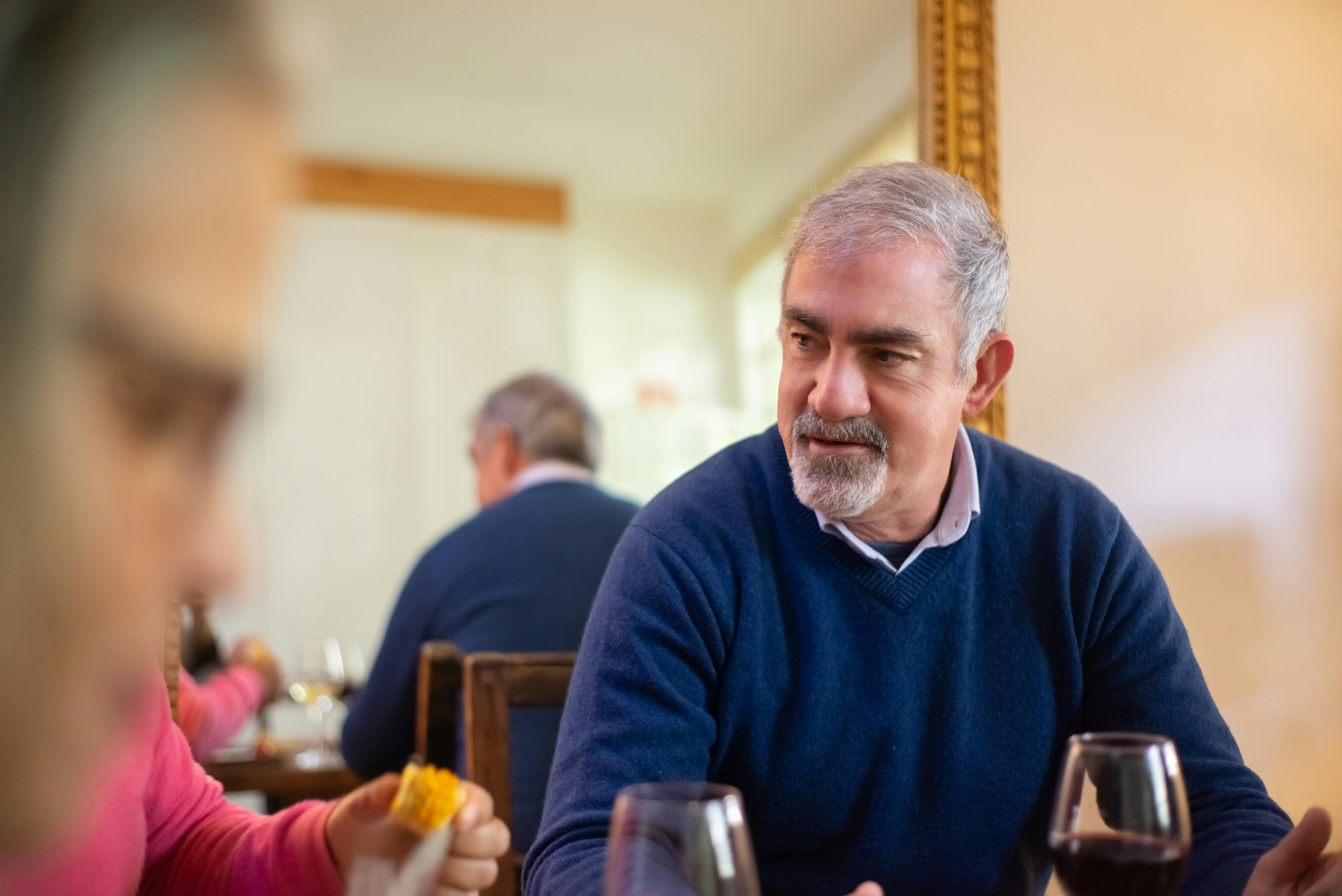 Serious man at a dinner table | Source: Pexels