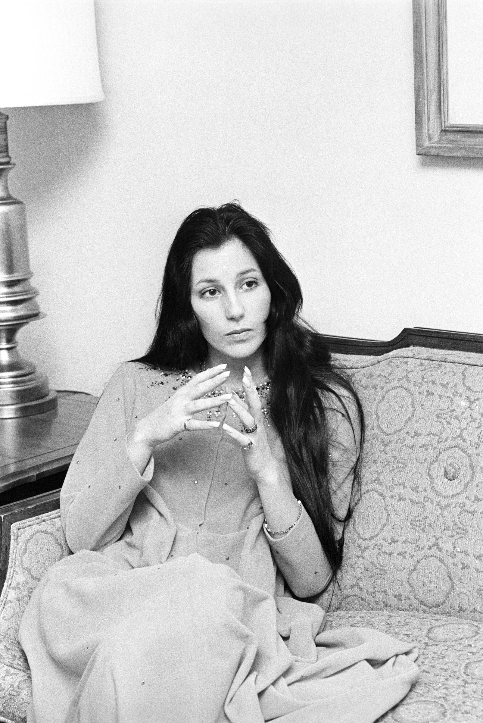 Cher looks on during an interview in 1969. | Source: Getty Images