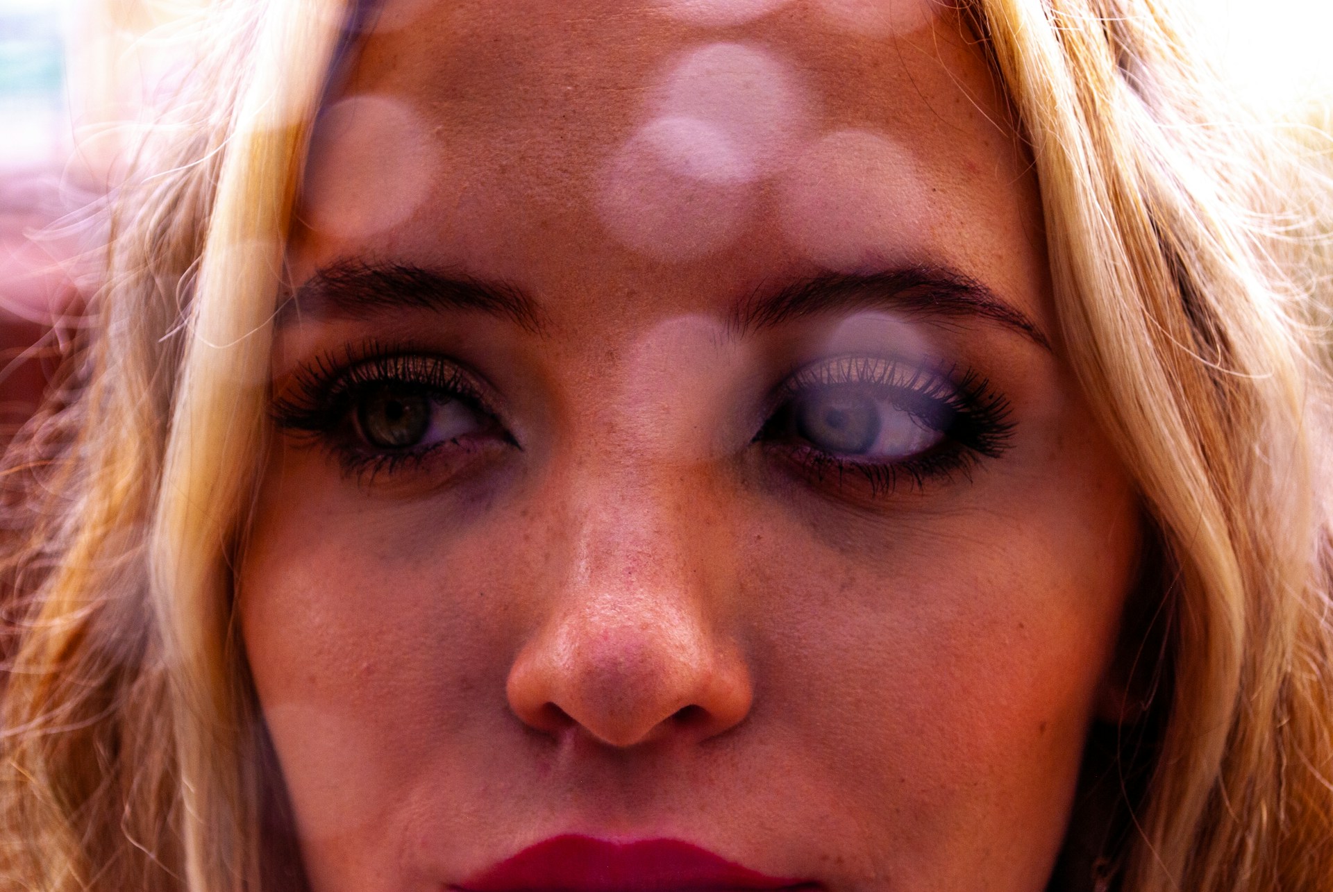 A woman glancing anxiously to one side | Source: Unsplash