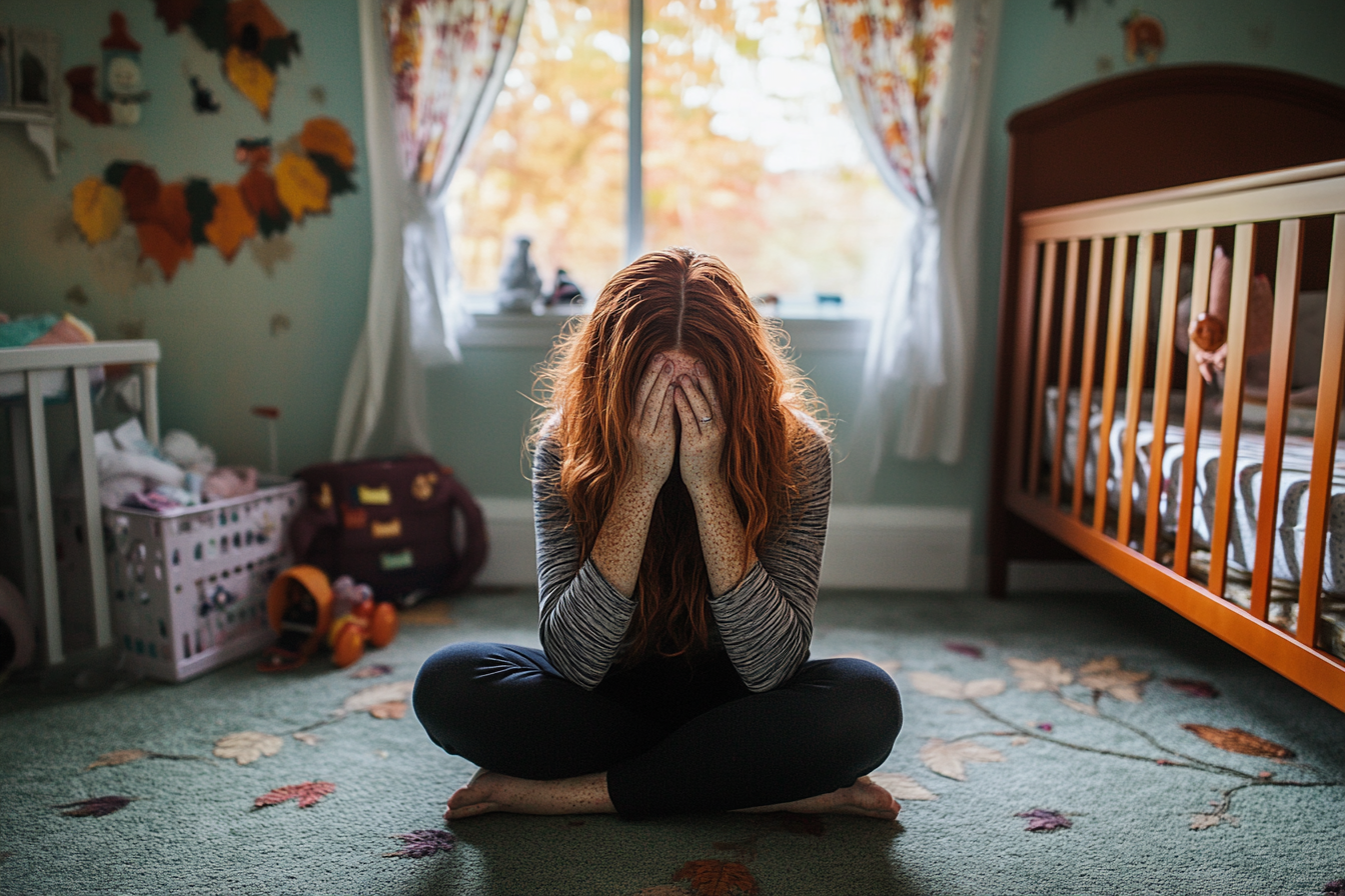 A woman crying in a nursery | Source: no source
