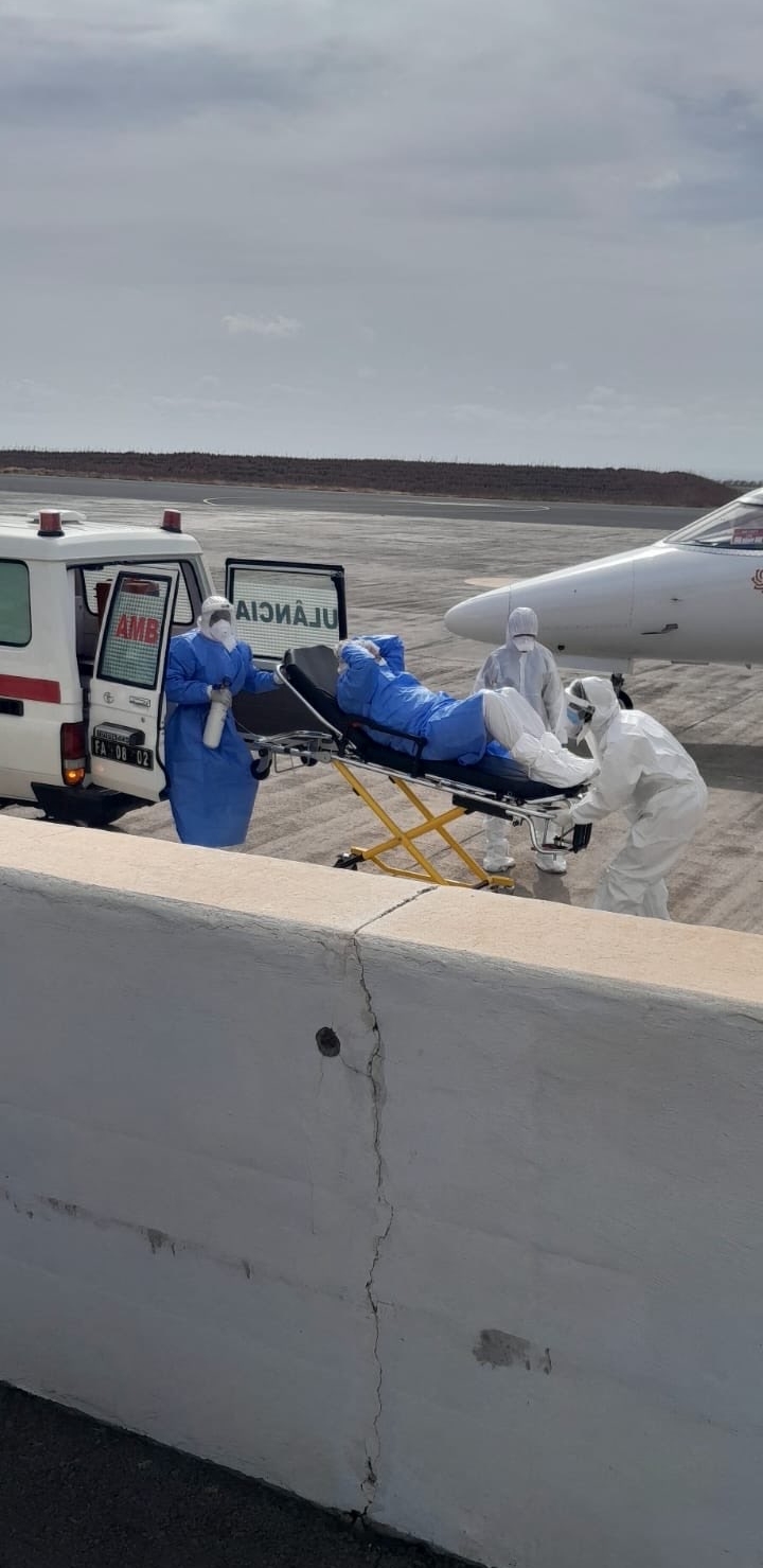 Health workers in protective gears transfer patients with an ambulance after three suspected cases of hantavirus is evacuated from a ship in Praia, Cape Verde, on May 6, 2026. | Source: Getty Images