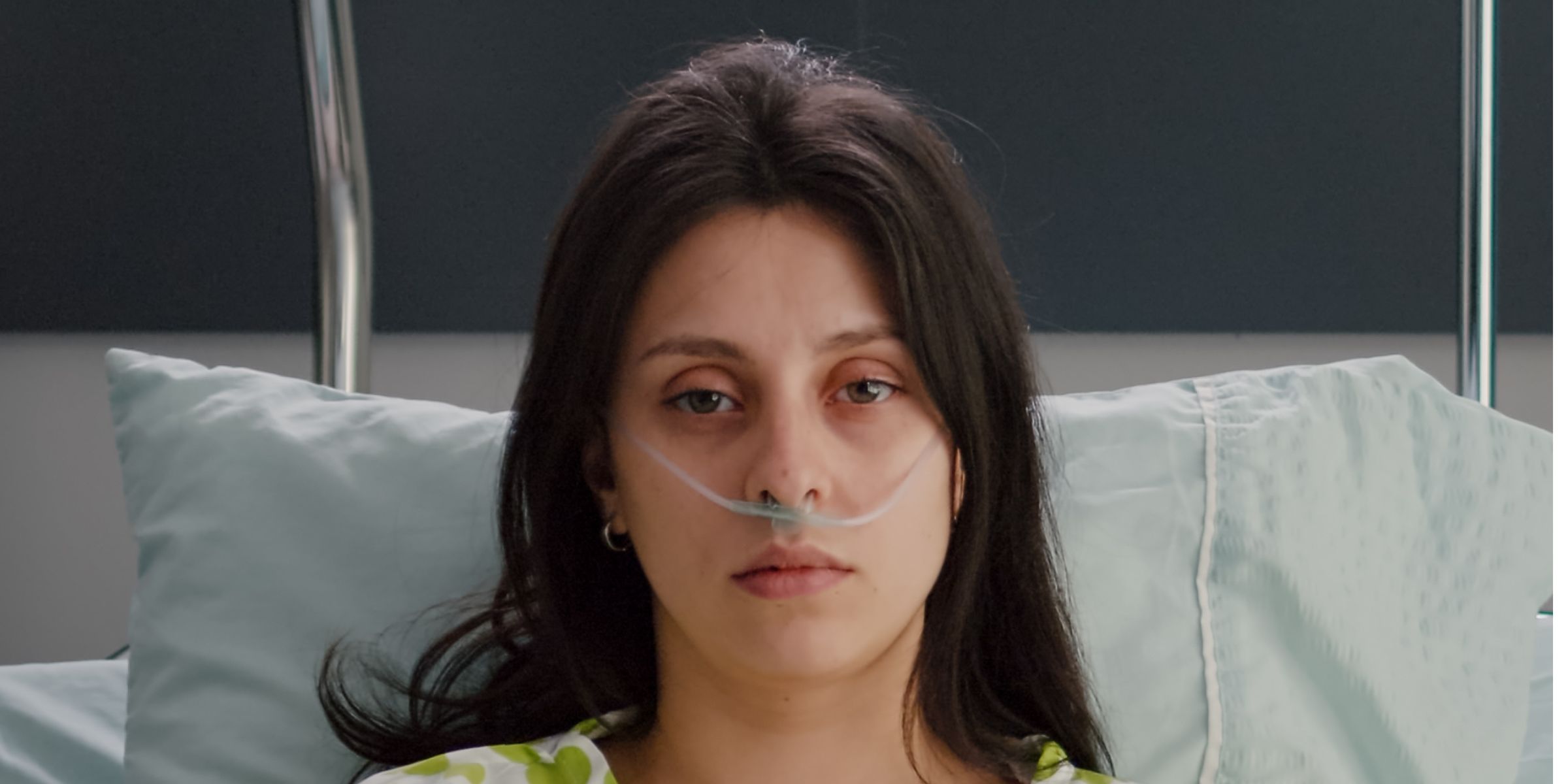 A sick woman with a nasal oxygen tube | Source: No source