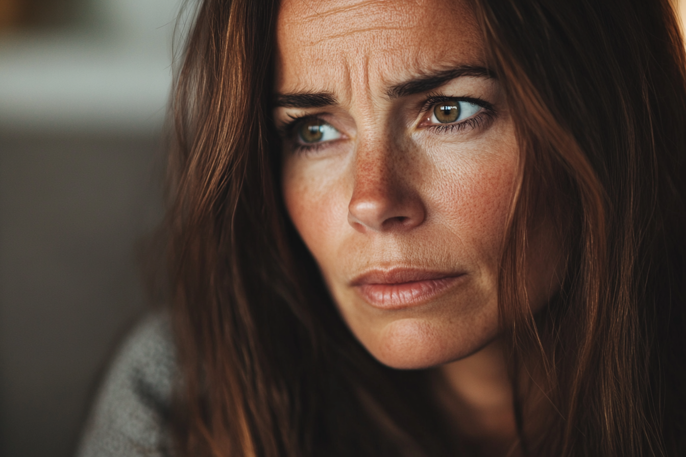 A tense woman staring at someone | Source: No source