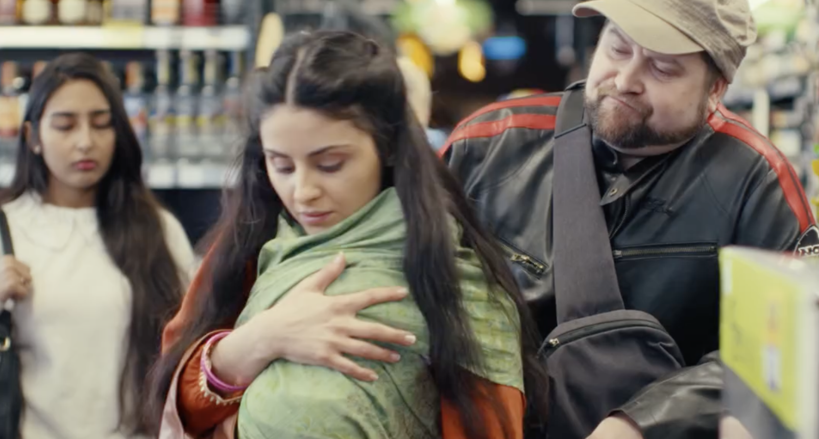 A woman with a child and a man in a supermarket | Source: Facebook/StoryWise