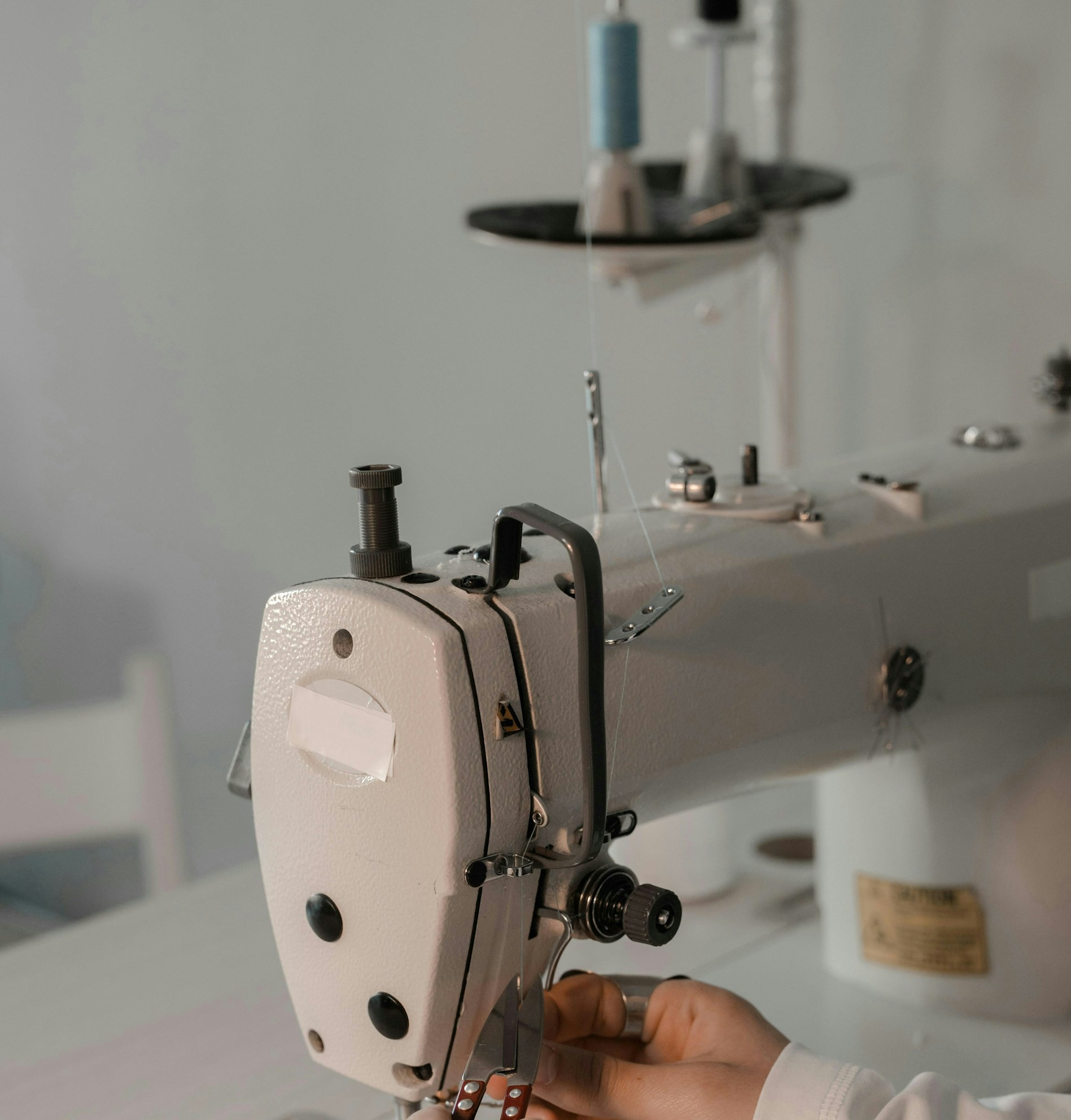 A person using a sewing machine | Source: Unsplash