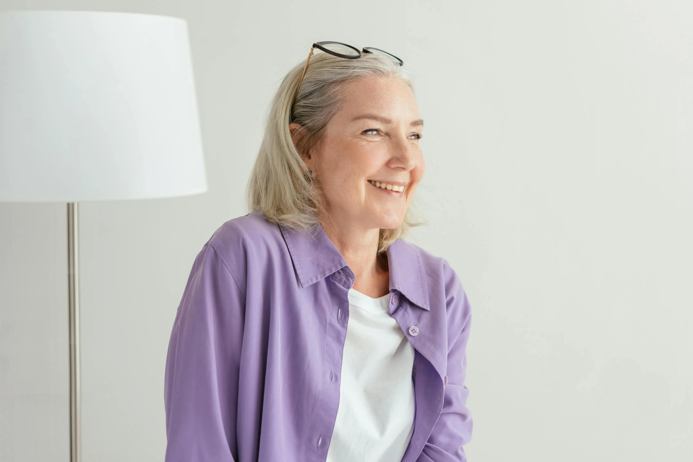 A laughing woman looking to her side | Source: Pexels