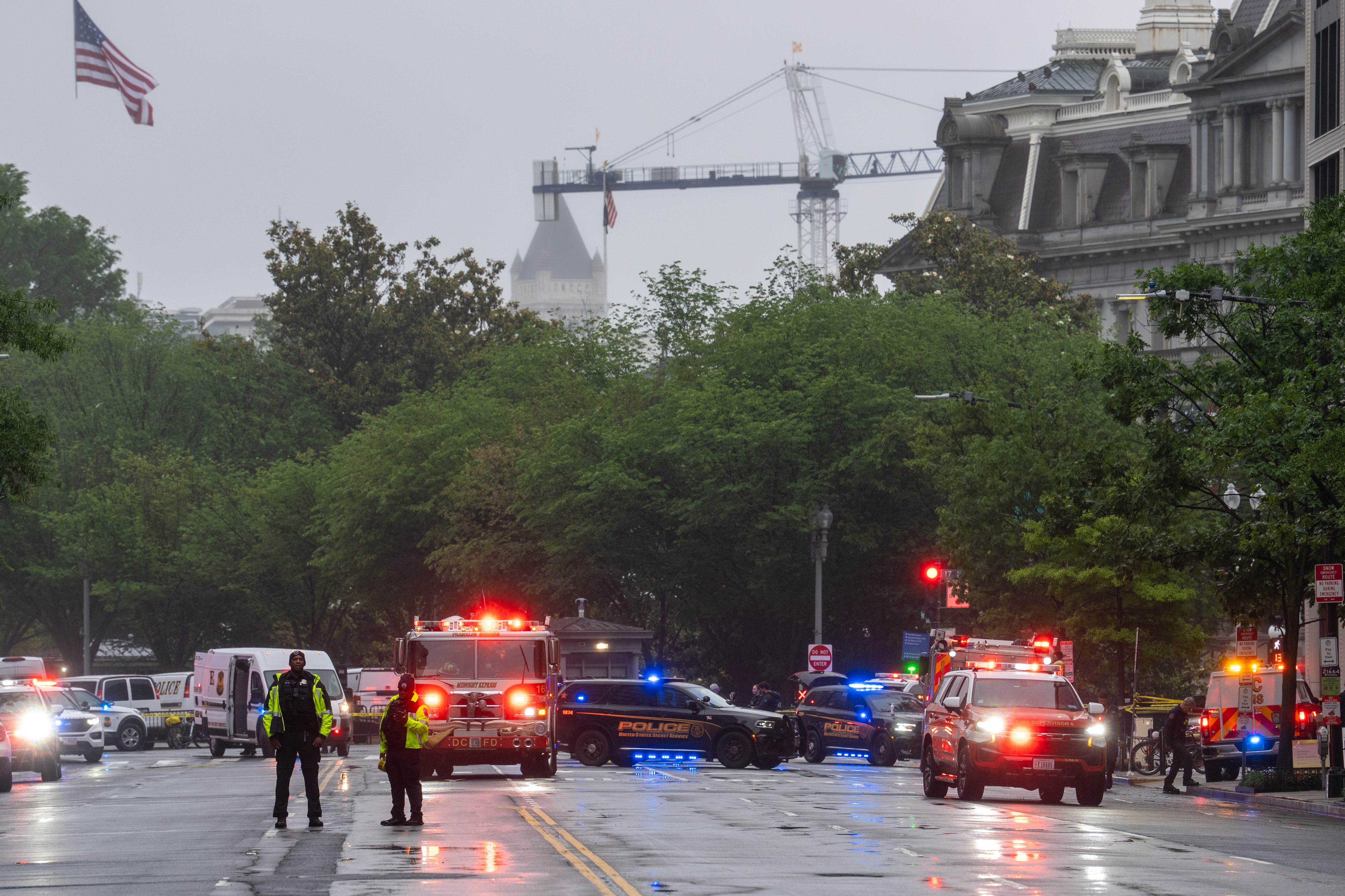 Emergency teams work the scene after multiple rapid-fire gunshots ring out near the White House on May 23, 2026 in Washington, DC. | Source: Getty Images