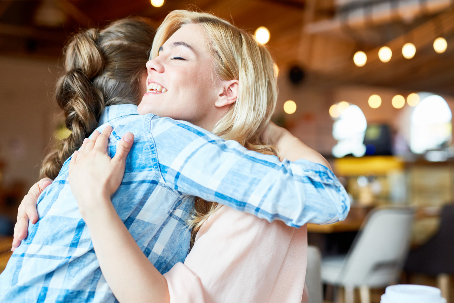 Two women embracing each other | Source: Freepik