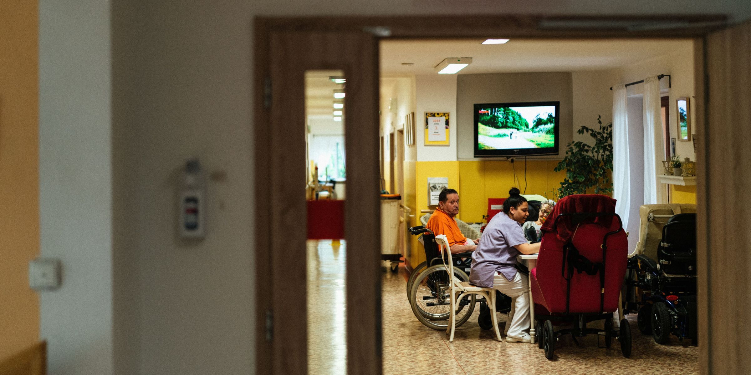A nurse sitting with patients at a care facility | Source: Pexels