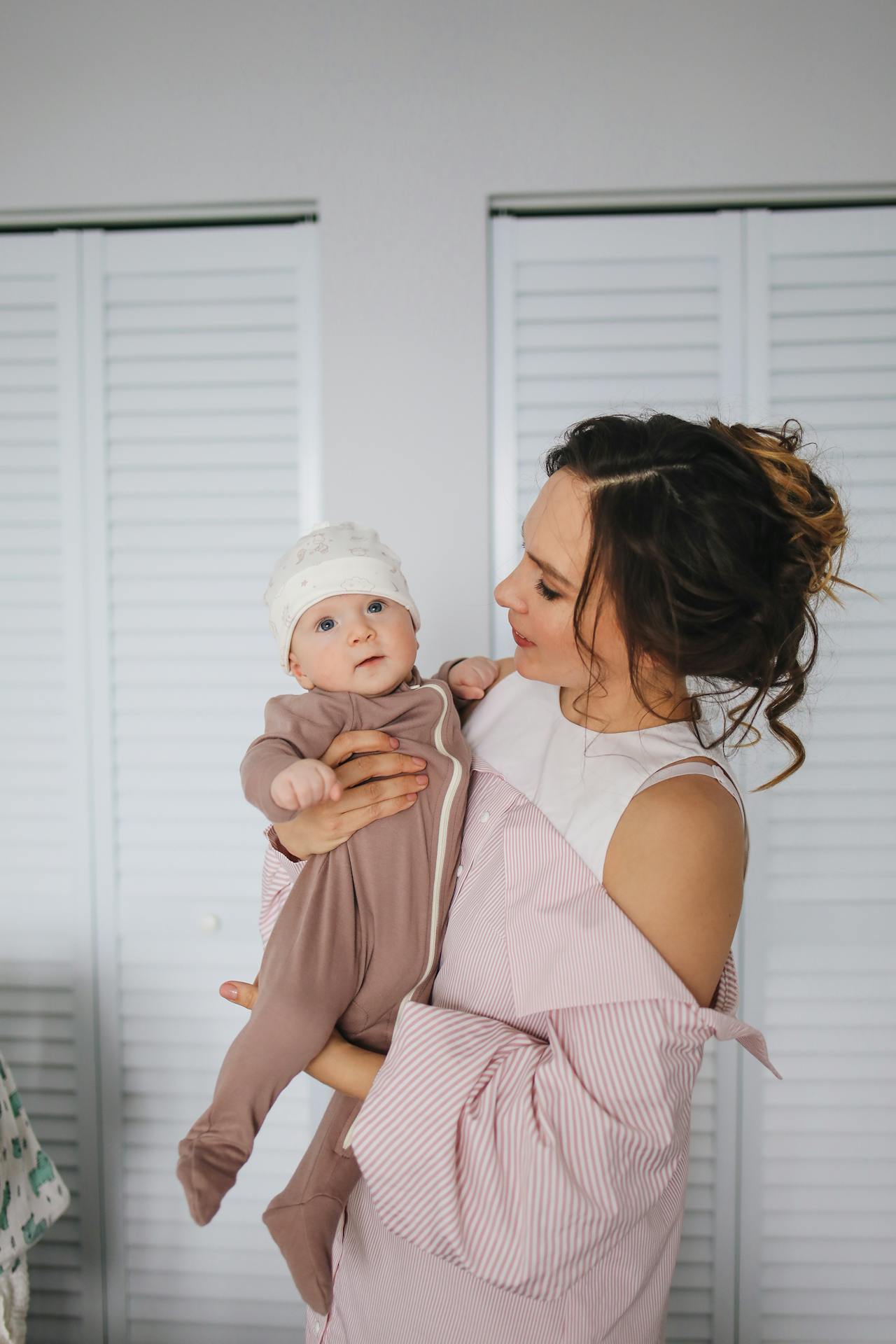 A mother holding her baby | Source: Pexels