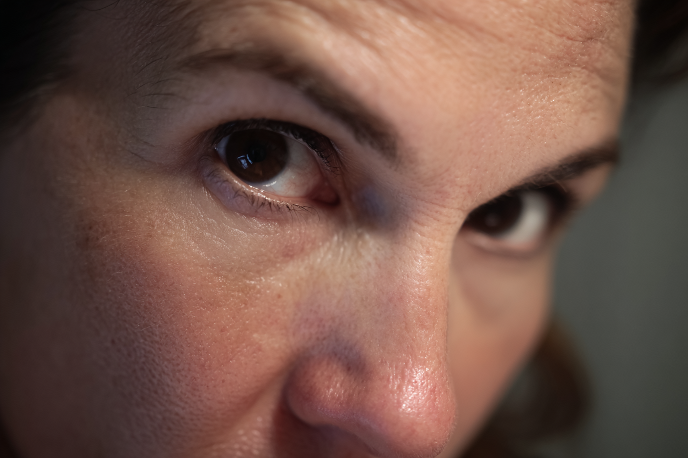 A close-up shot of a woman's face | Source: no source