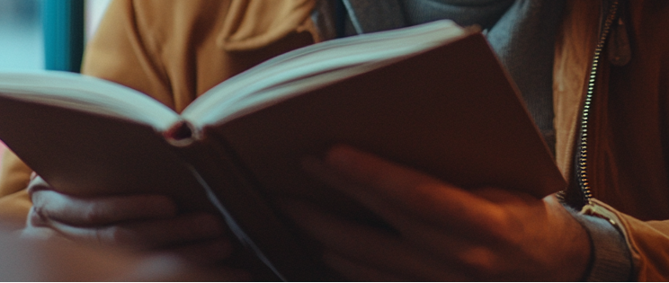 Someone holding a book | Source: no source