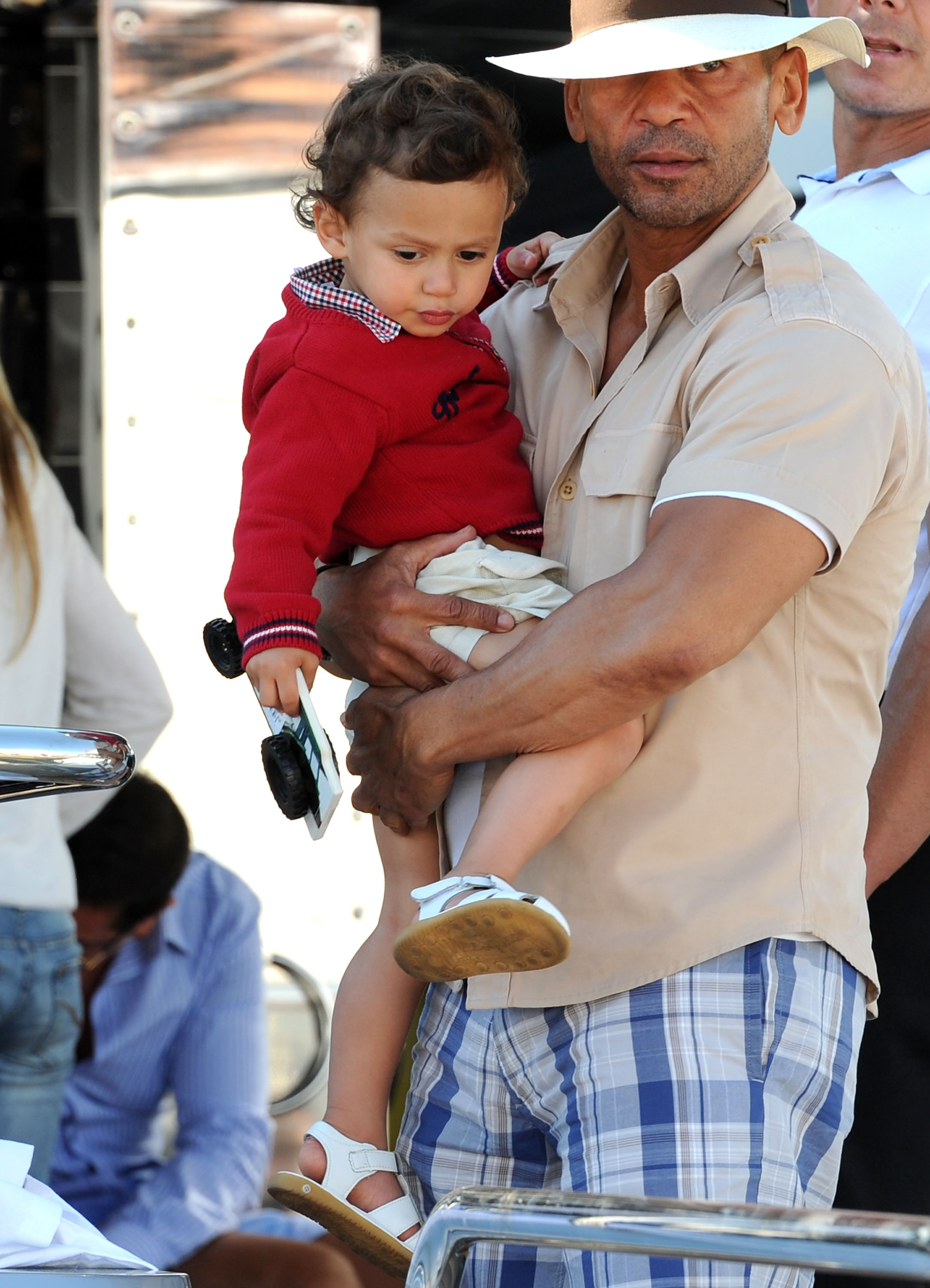 Benny Medina holds Maximilian David Muniz during the 63rd Cannes Film Festival on May 23, 2010 | Source: Getty Images