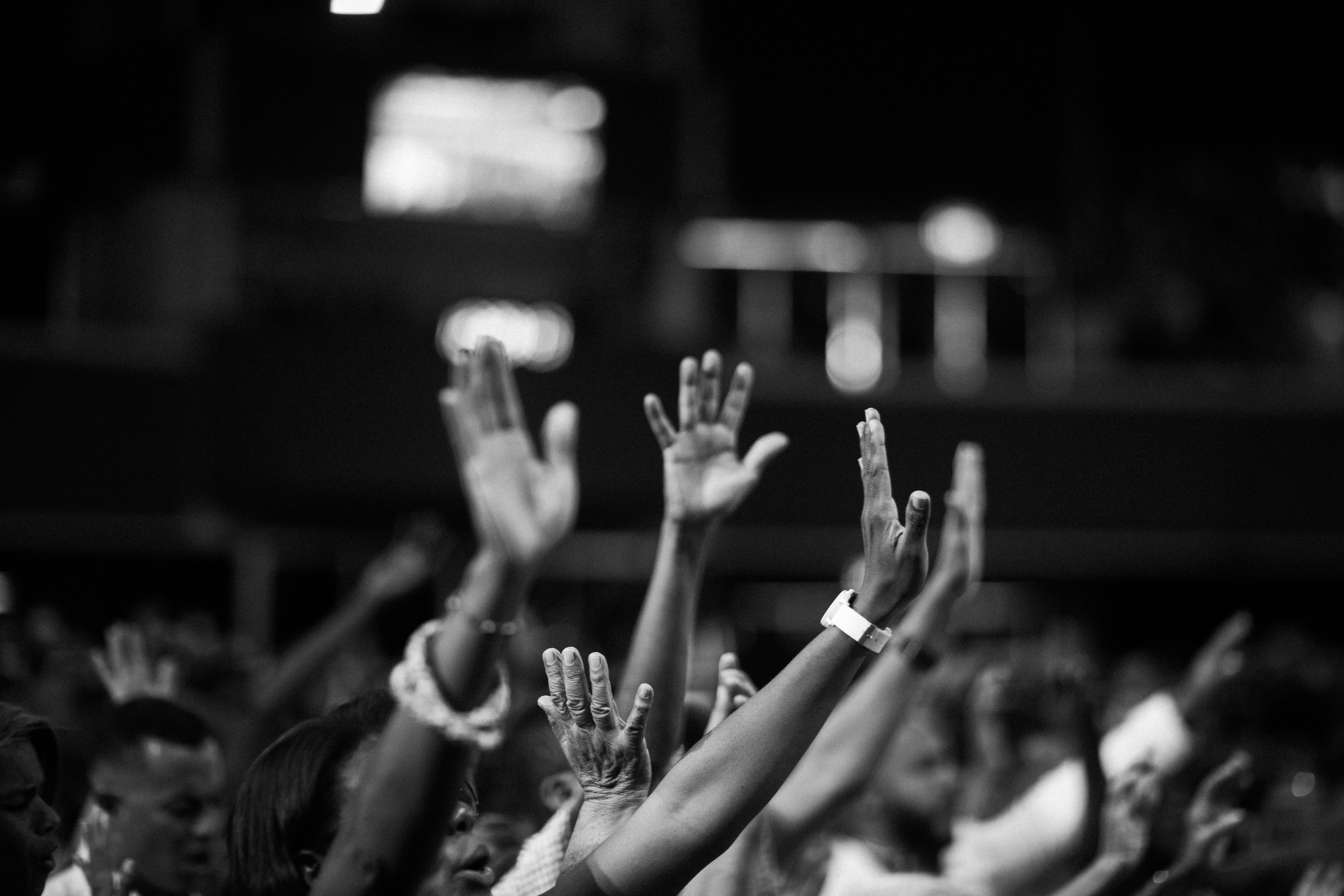 People raising their hands in a concert | Source: Pexels