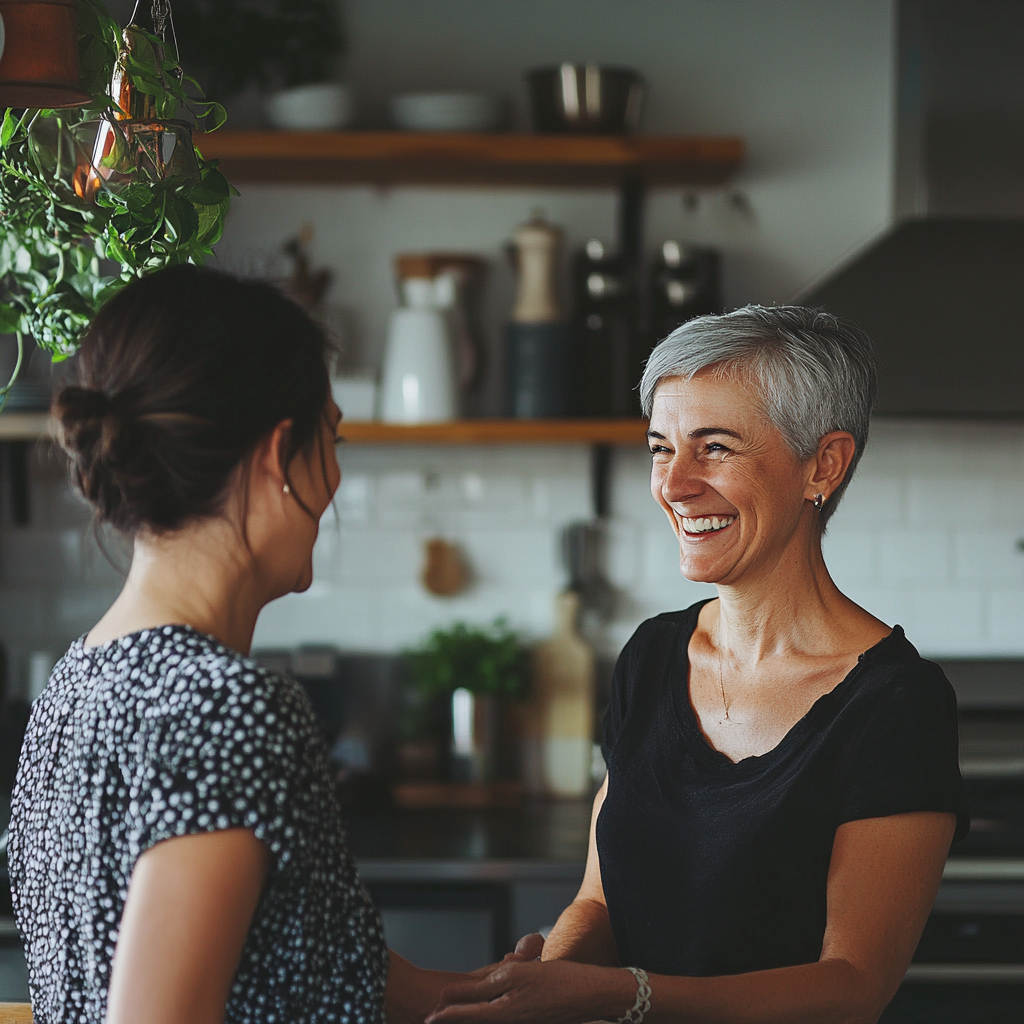 Two women smiling at each other | Source: No source