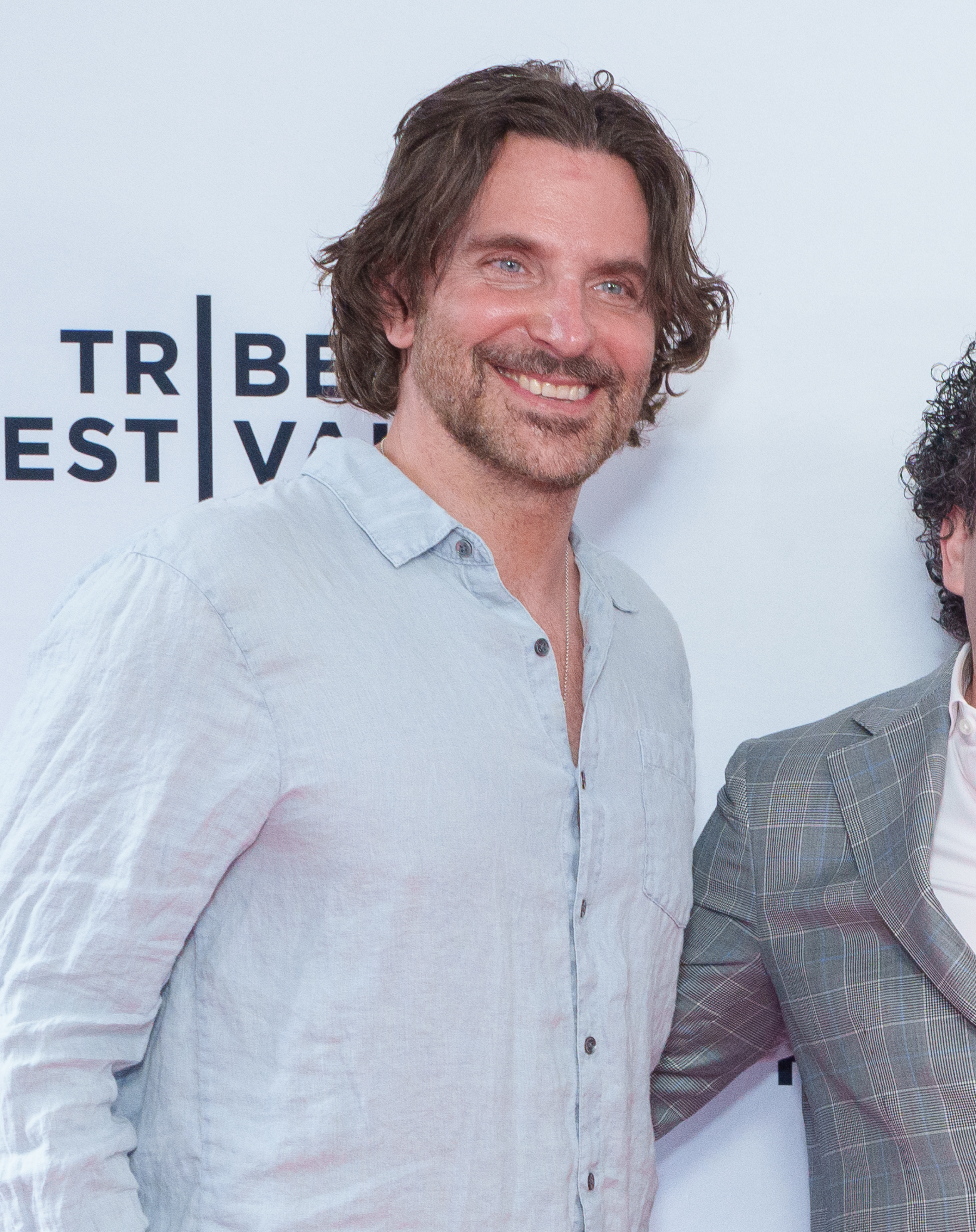 Cooper showed genuine smile that accentuated the fine lines around his blue eyes. He also wore a full, well-maintained beard with his now-signature salt-and-pepper blend, as he attended the "All We Cannot See" premiere during the 2025 Tribeca Festival at AMC 19th Street on June 8, 2025, in New York City.