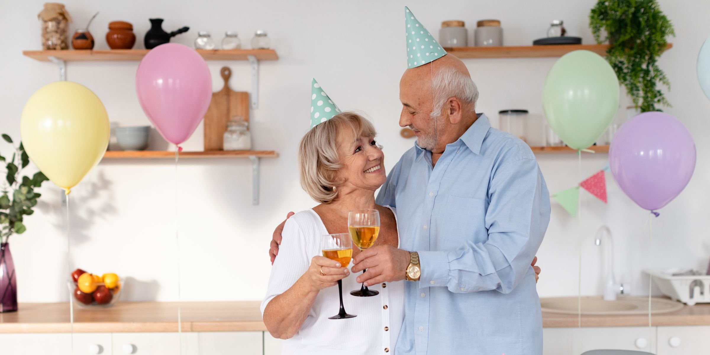 A happy elderly couple toasting at a party | Source: No source