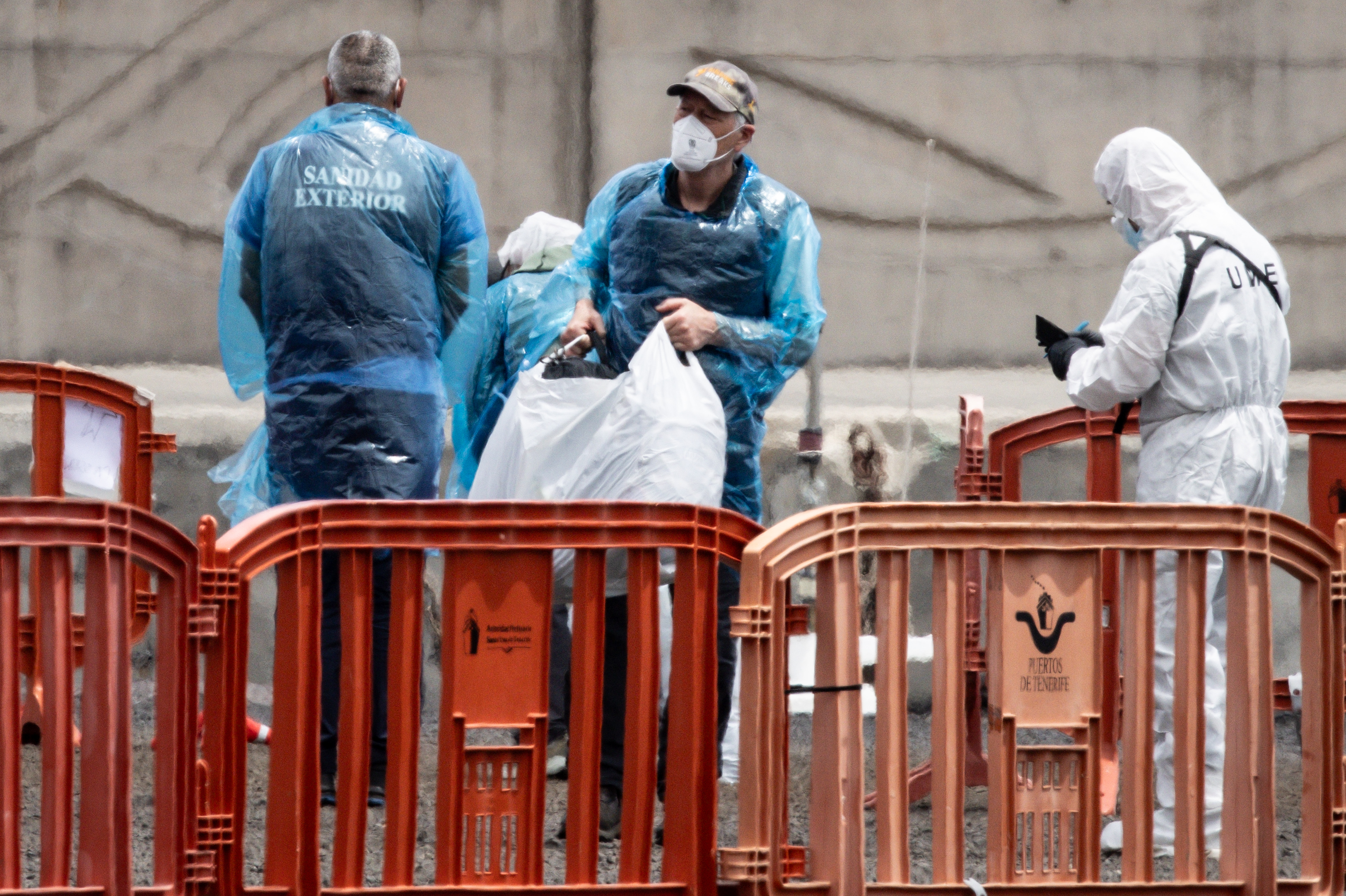 Passengers being evacuated from the MV Hondius after docking in the Granadilla Port on May 10, 2026 in Tenerife, part of the Canary Islands, Spain | Source: Getty Images