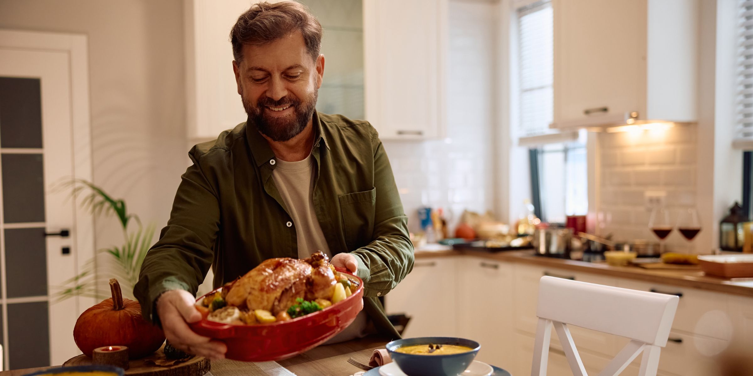 A man setting the dinner table | Source: Shutterstock