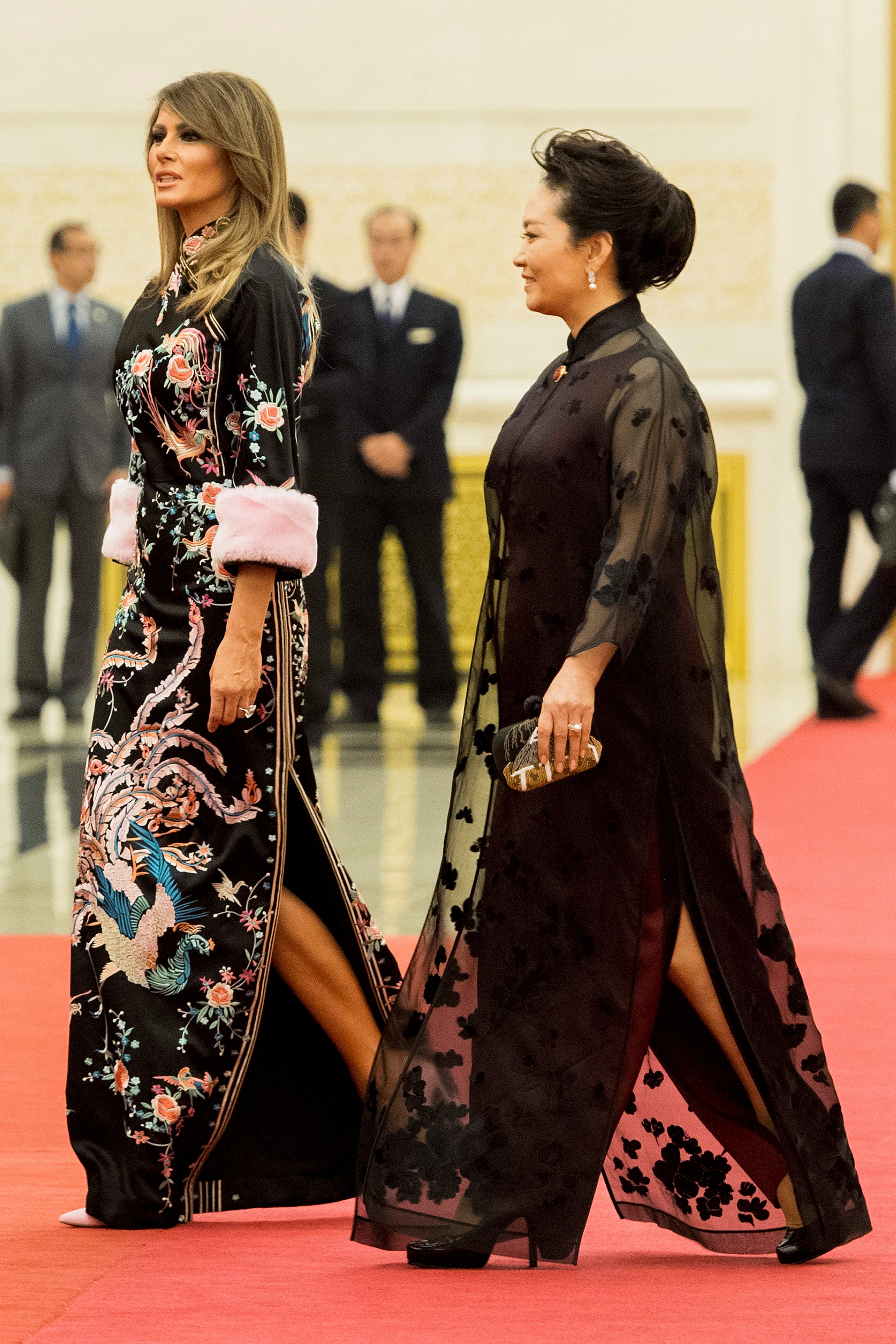 U.S. First Lady Melania Trump walking with Peng Liyuan, wife of China's President Xi Jinping at the Great Hall of the People in Beijing, China on November 9, 2017. | Source: Getty Images