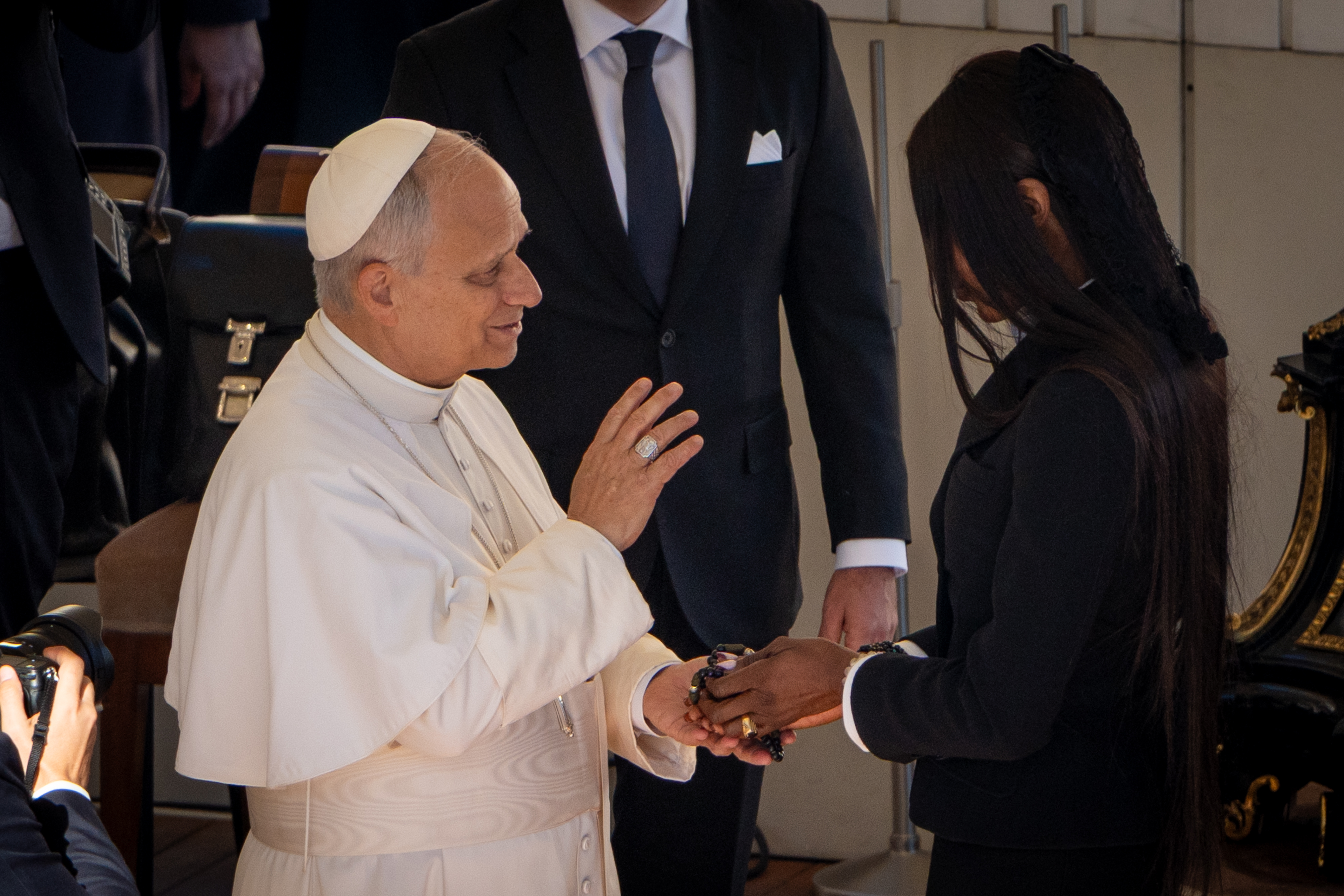 Pope Leo XIV interacting with the famous woman during the General Audience at St. Peter's Square in Vatican City, Rome on November 12, 2025. | Source: Getty Images