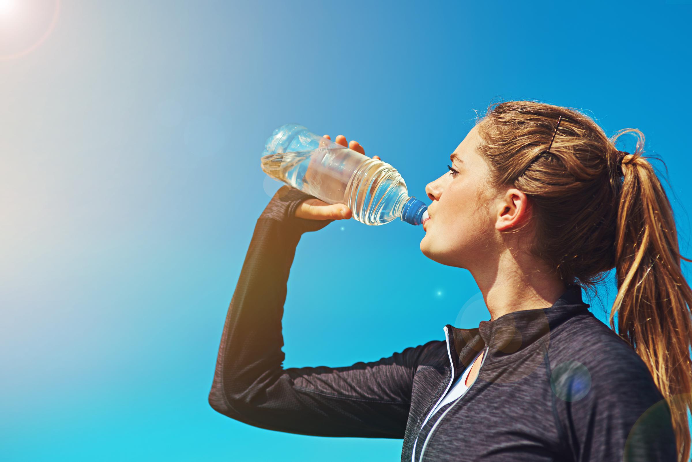 A woman drinking water | Source: Getty Images