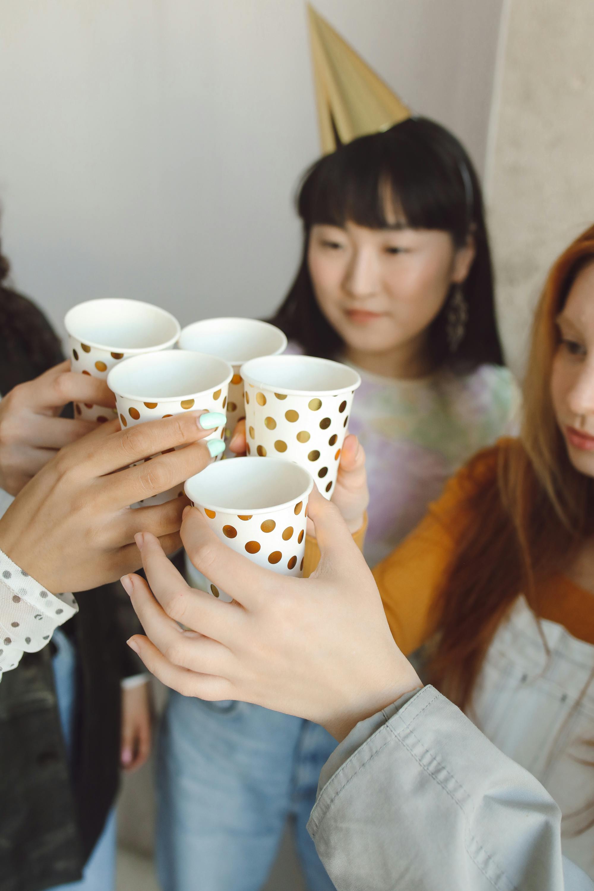 Toasting with plastic cups | Source: Pexels