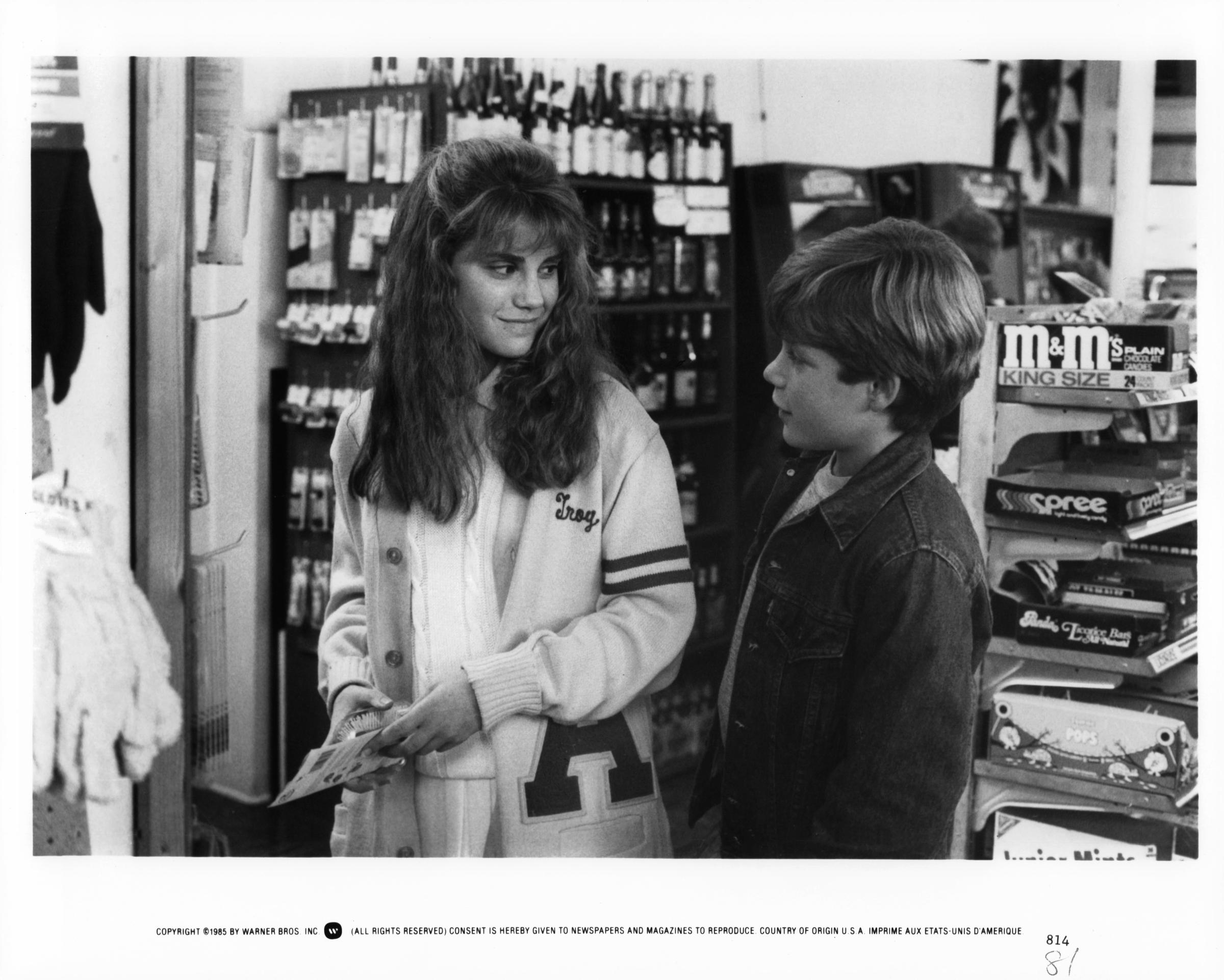 Kerri Green and Sean Astin talk in store, in a scene from the film "Goonies," in 1985 | Source: Getty Images