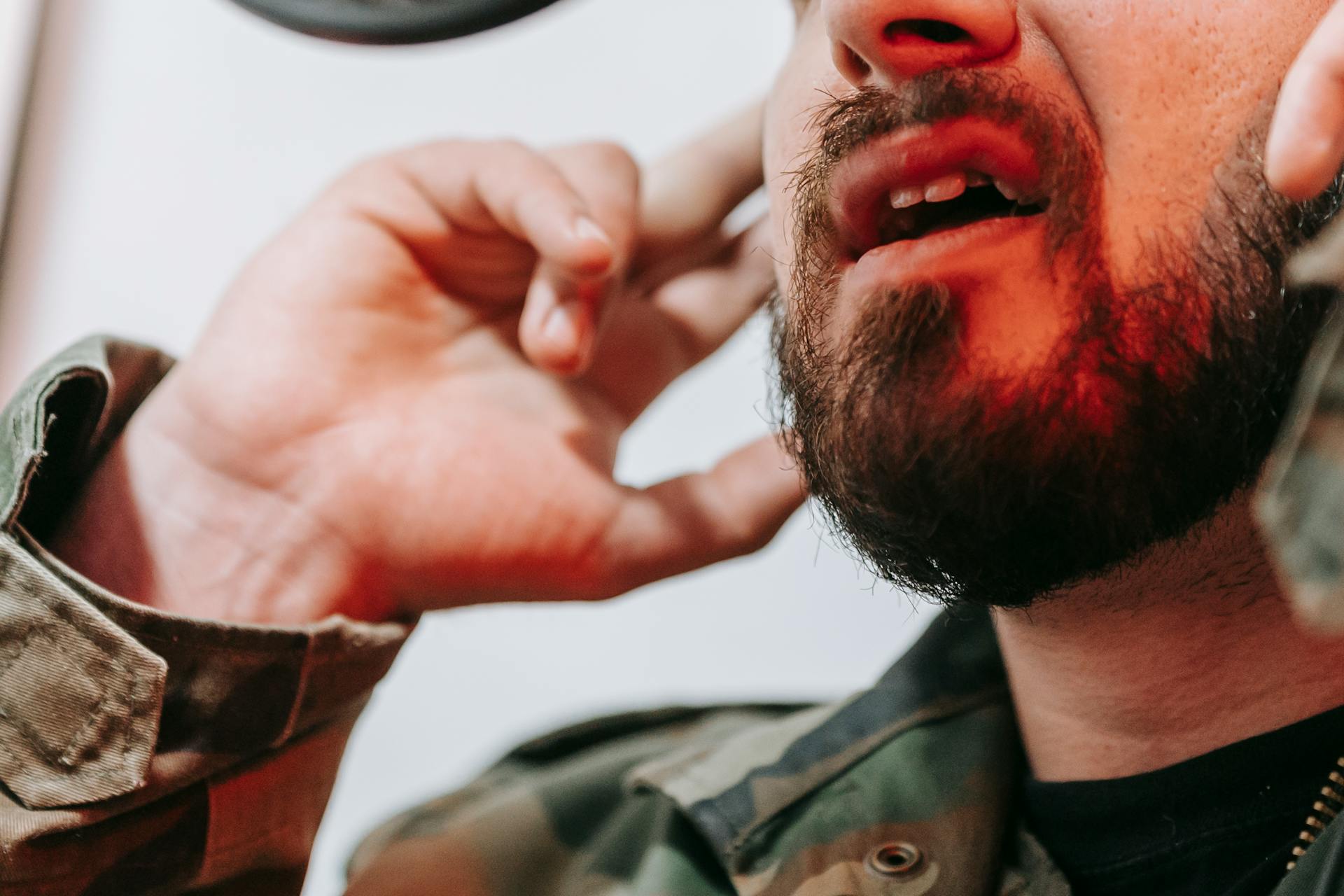 A man speaking on a phone | Source: Pexels