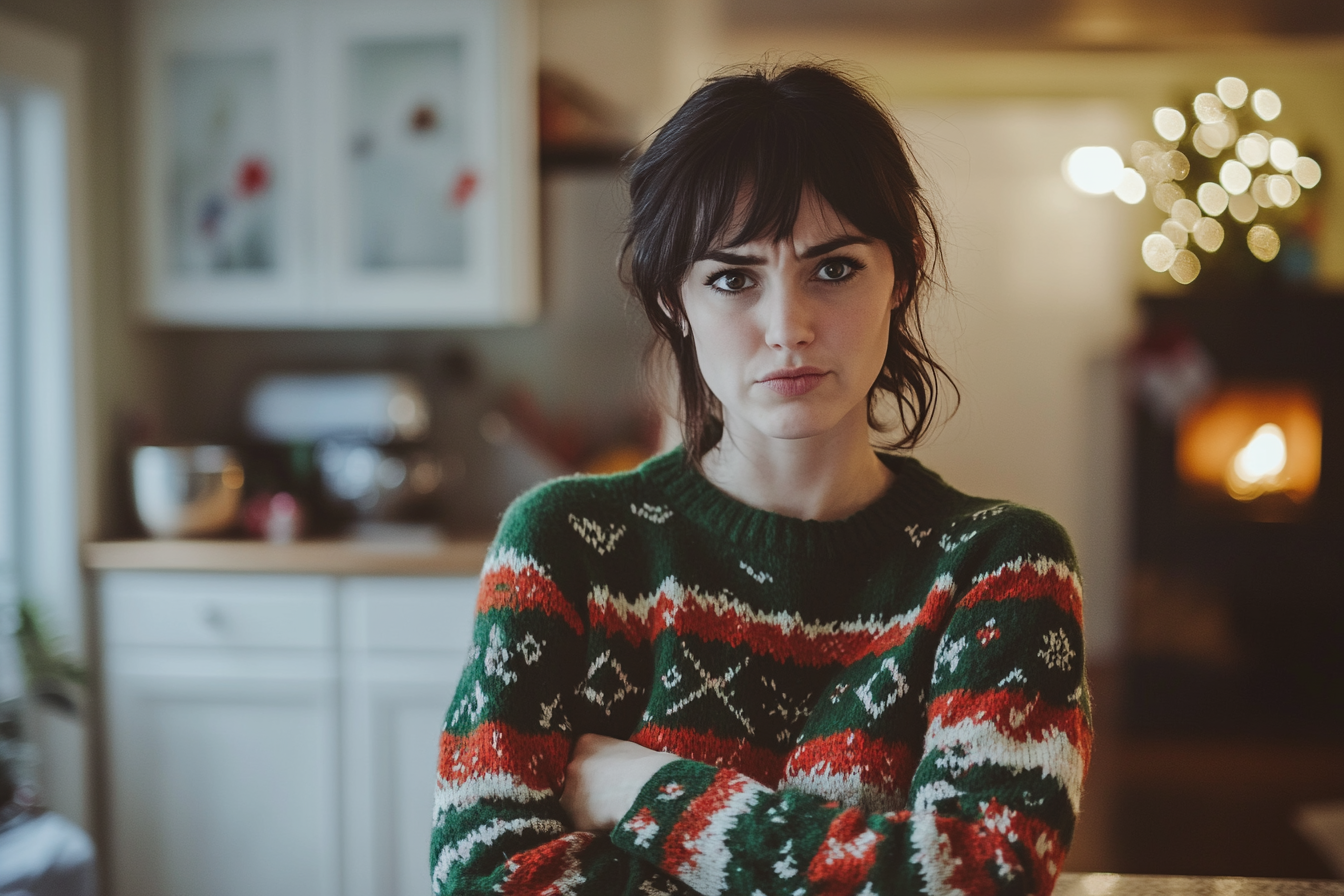 An angry woman standing in a kitchen | Source: No source