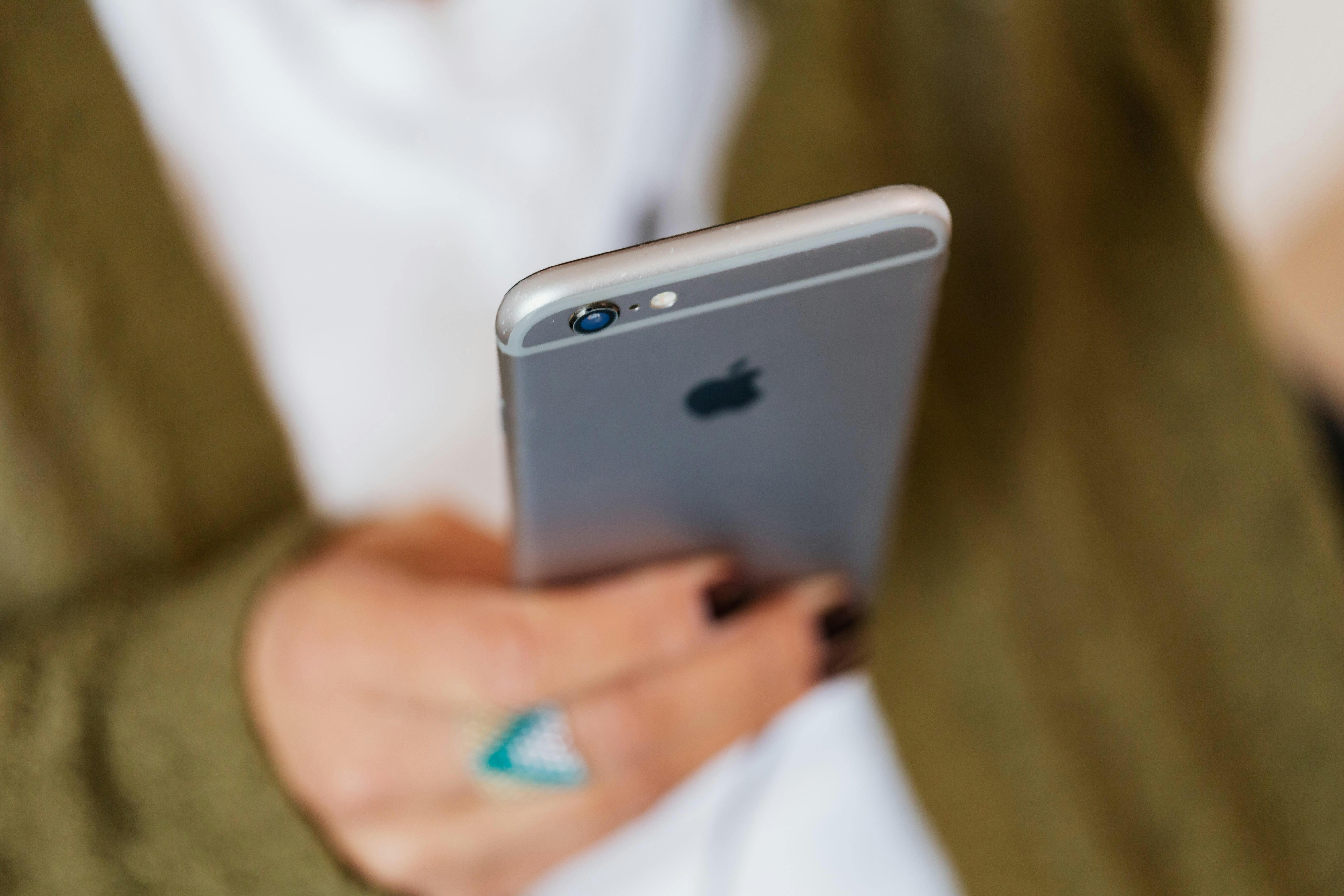 A woman looking at a phone | Source: Pexels