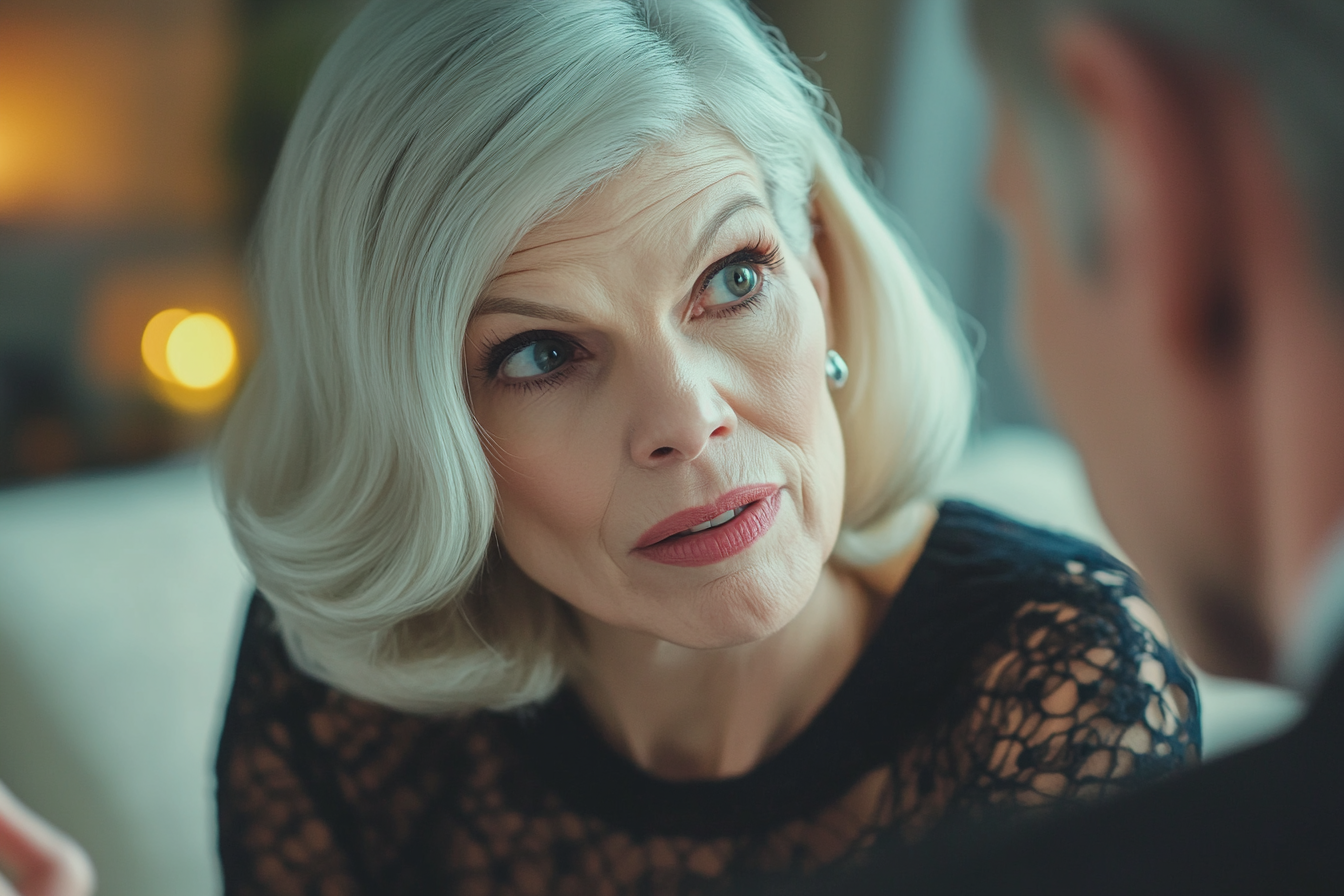 A woman with a serious expression speaking to someone | Source: No source
