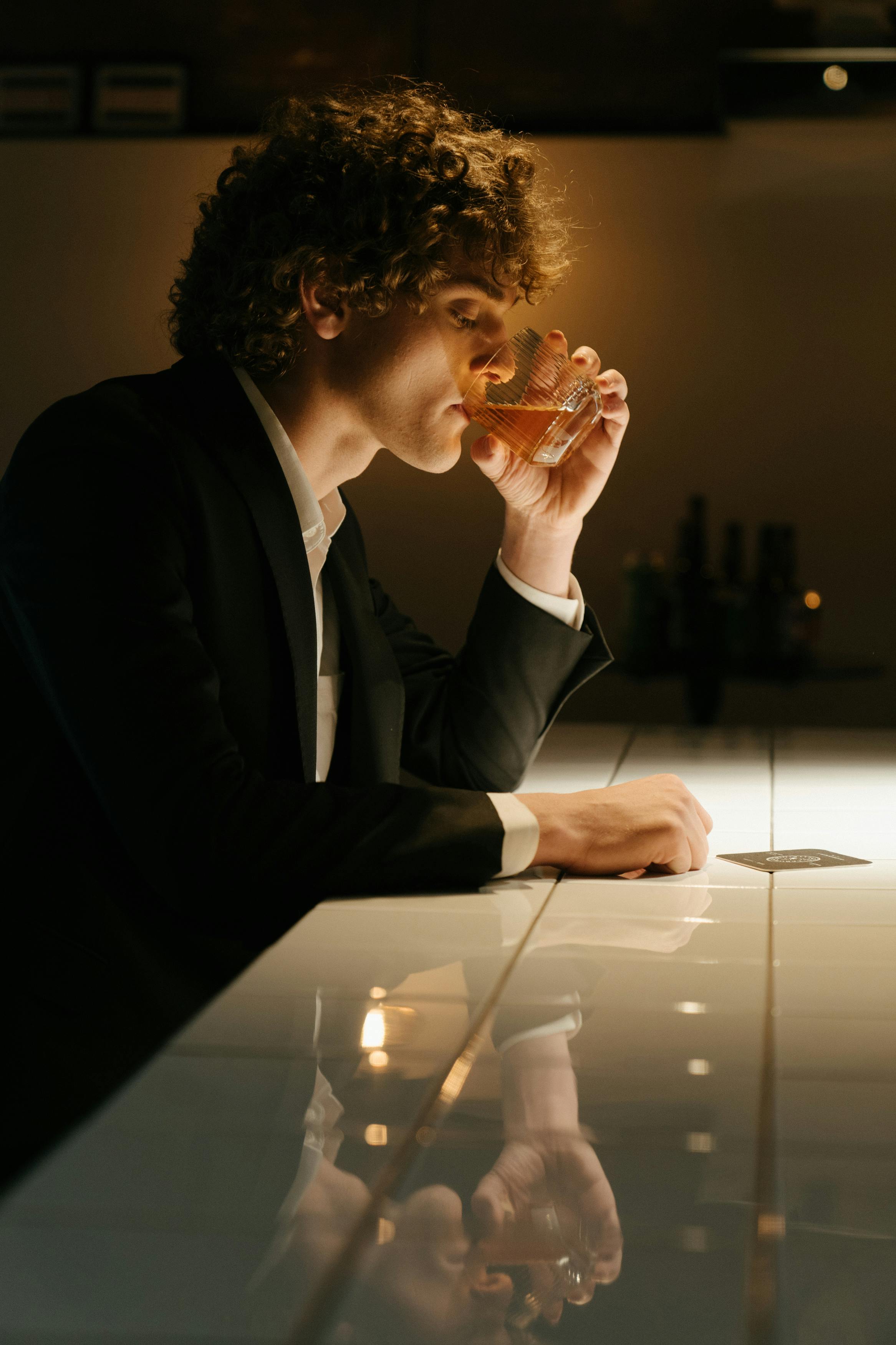 A man sitting at a bar | Source: no source