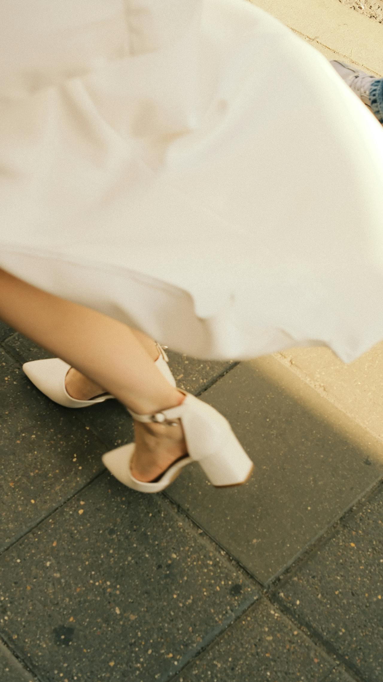 A woman walking on a pavement | Source: Pexels