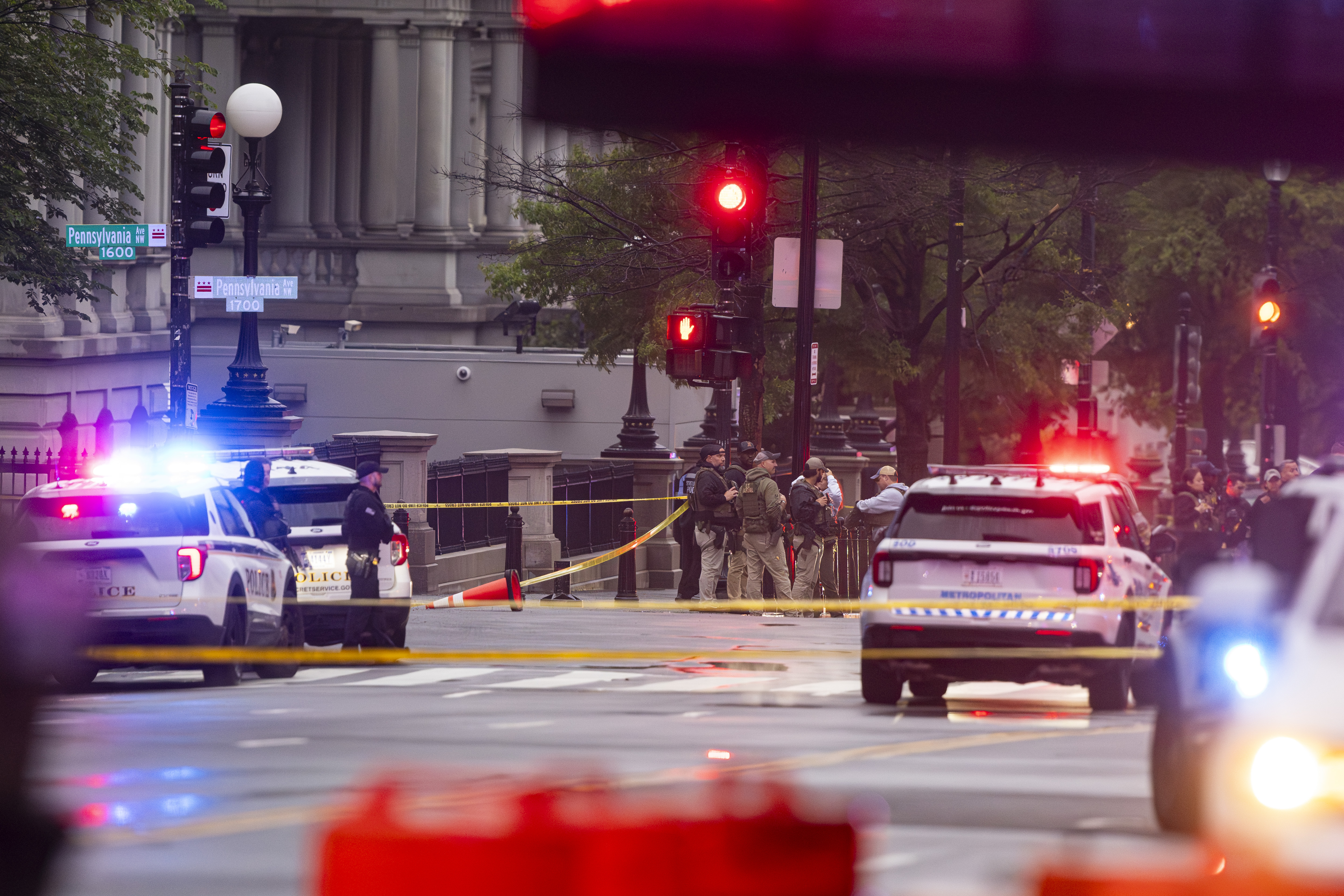 Emergency teams work the scene after multiple rapid-fire gunshots ring out outside the White House on May 23, 2026 in Washington, DC. | Source: Getty Images