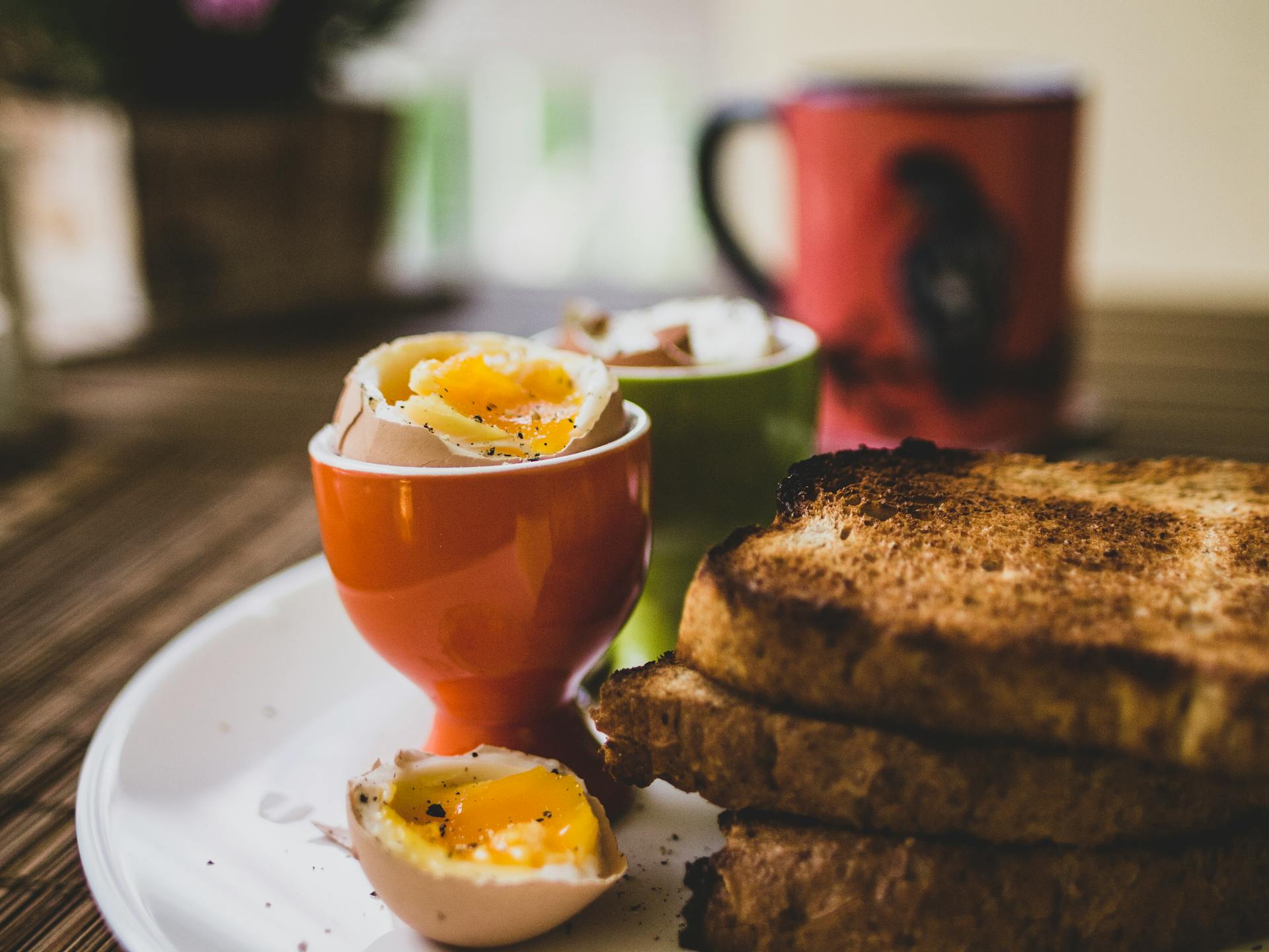 A boiled egg and slices of toast | Source: no source
