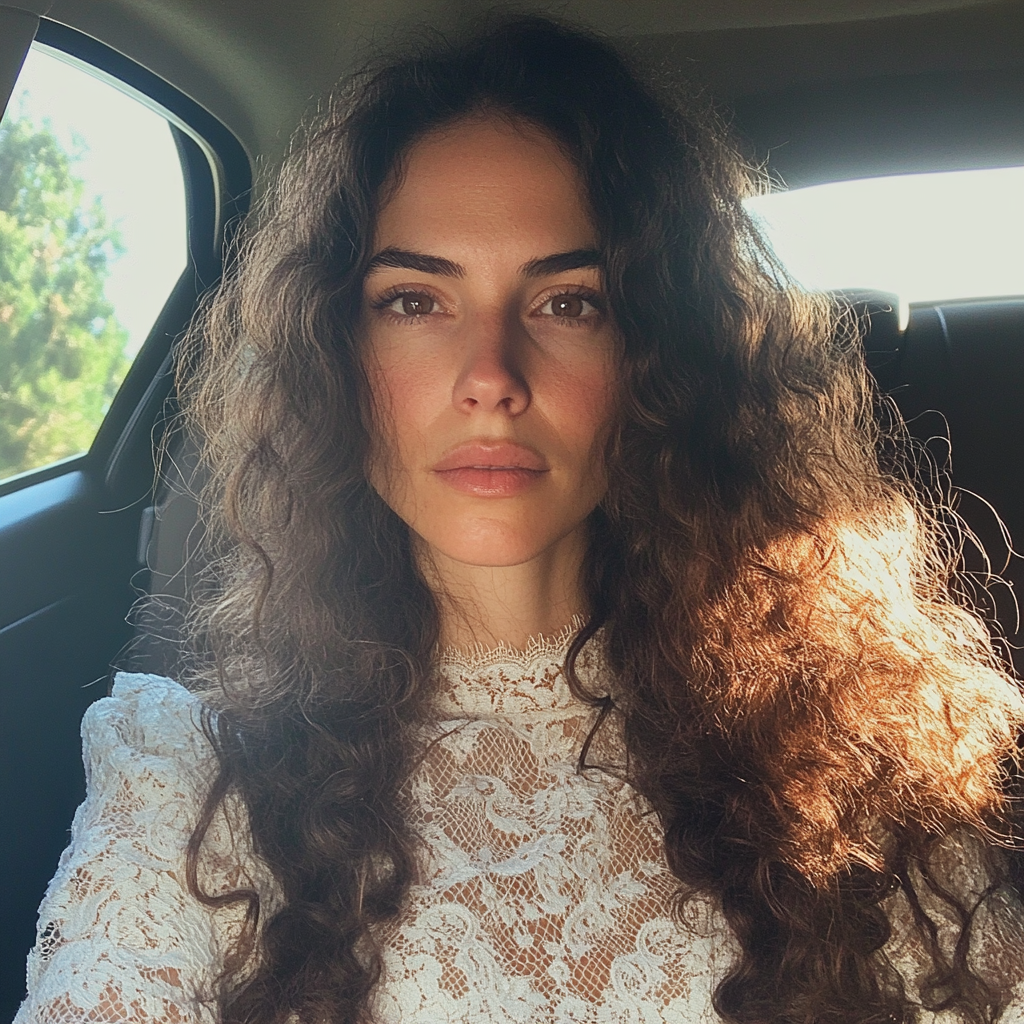 A bride sitting in a car | Source: no source
