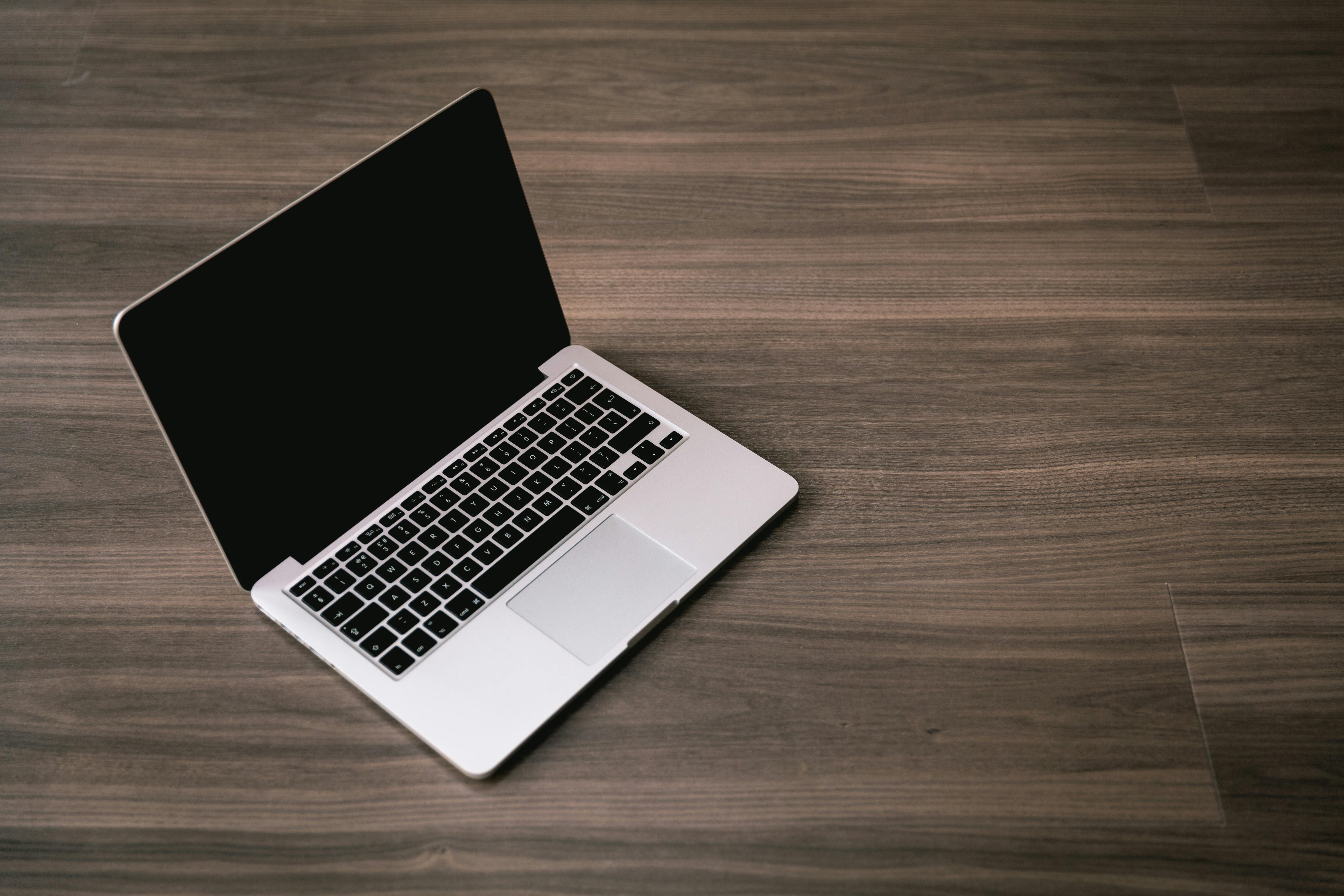 Laptop on a brown background | Source: No source