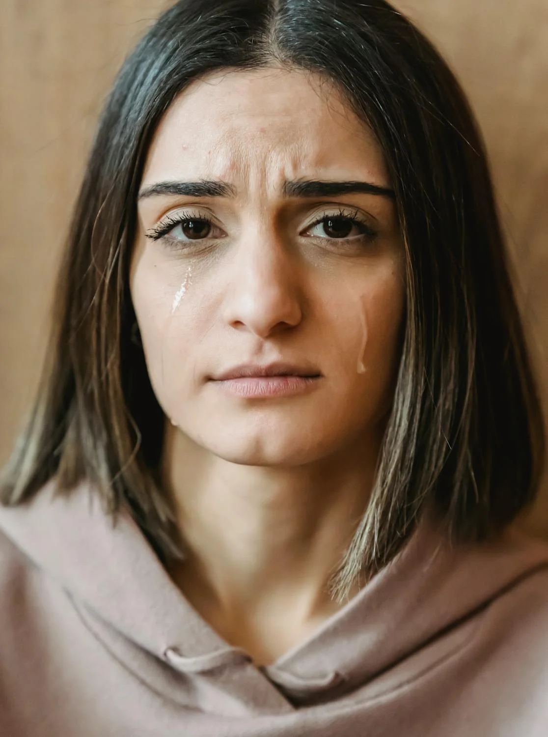 A young woman crying | Source: Pexels