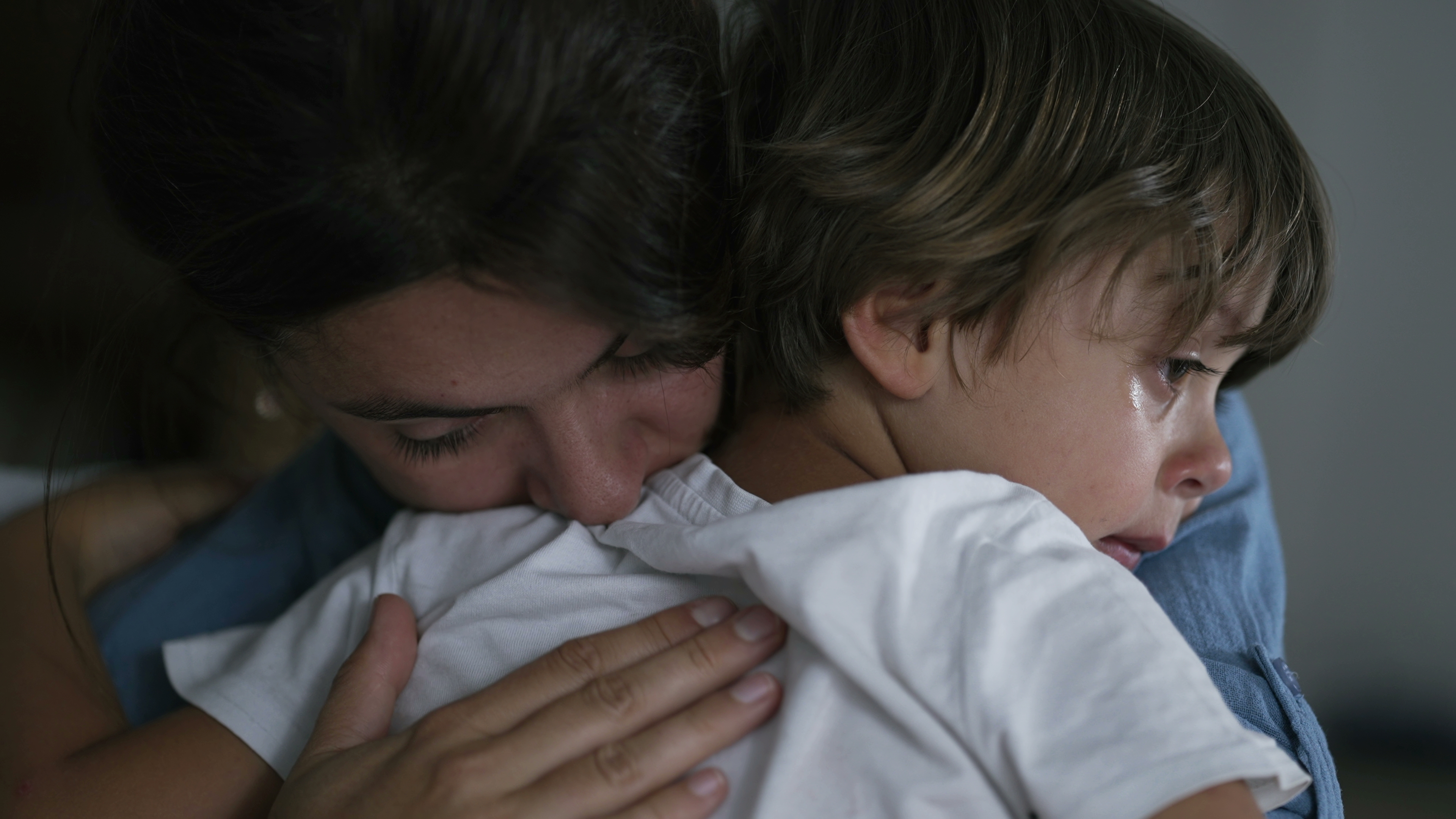Mother is hugging her crying son | Source: Shutterstock.com