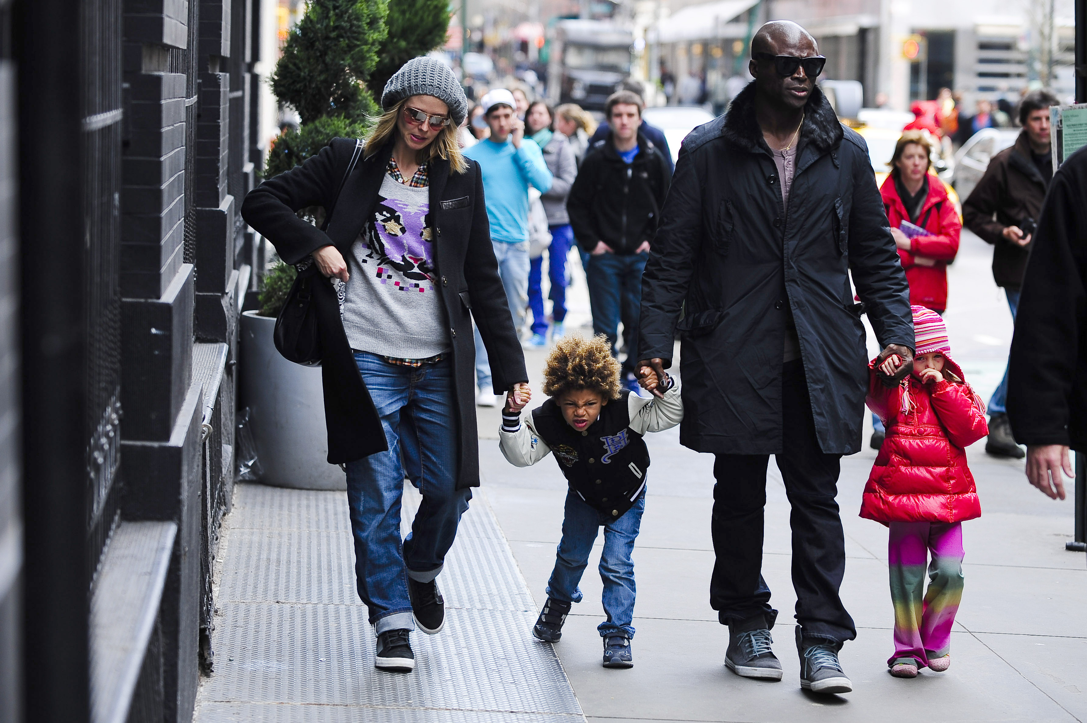 Television personality Heidi Klum, son Henry Samuel, singer Seal, and daughter Leni Klum walk in Soho on April 13, 2009 in New York City. | Source: Getty Images