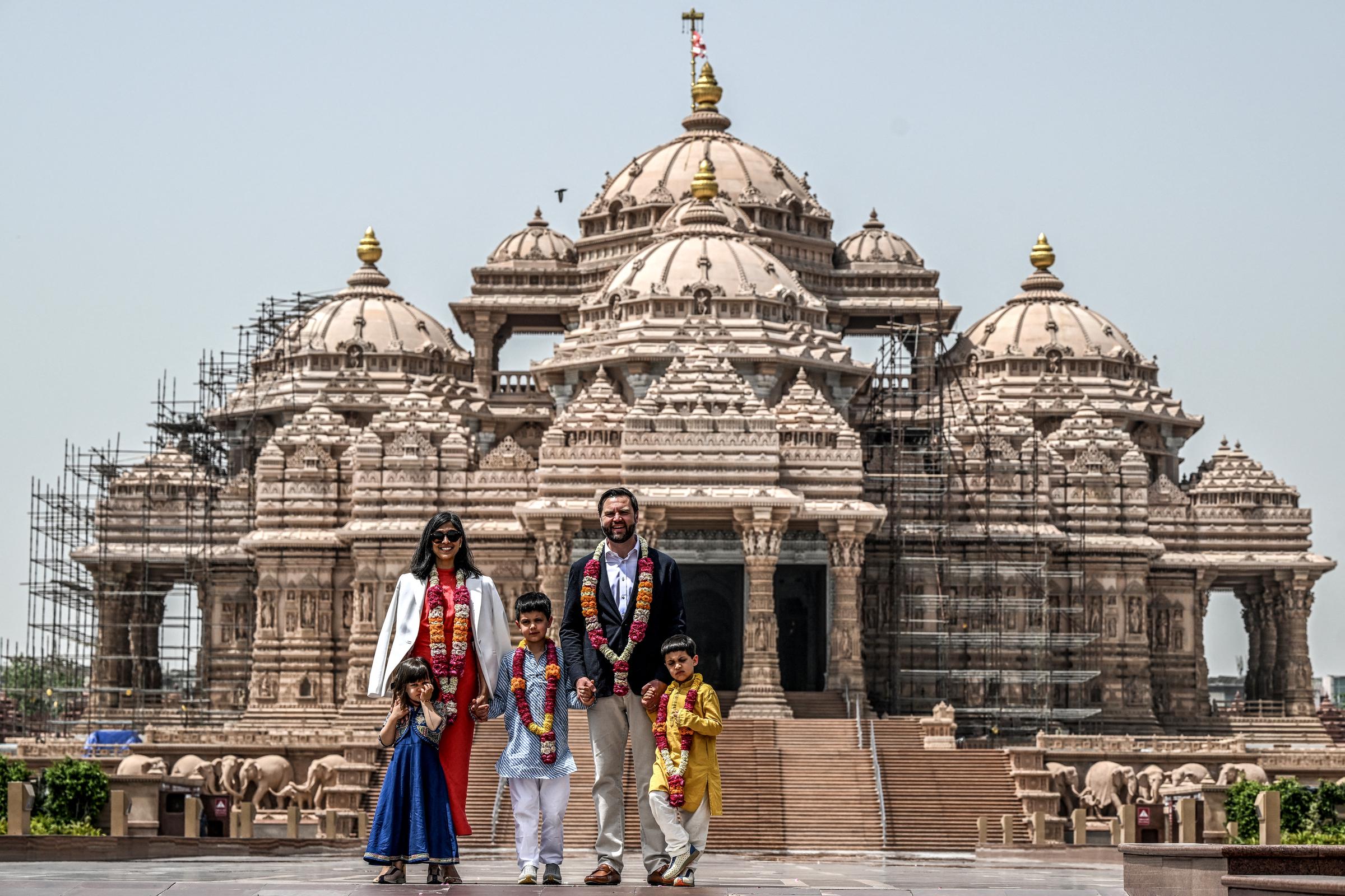 JD Vance and his wife Usha are with their children Ewan, Vivek and Mirabel in front of the Akshardham Temple in New Delhi on April 21, 2025. | Source: Getty Images