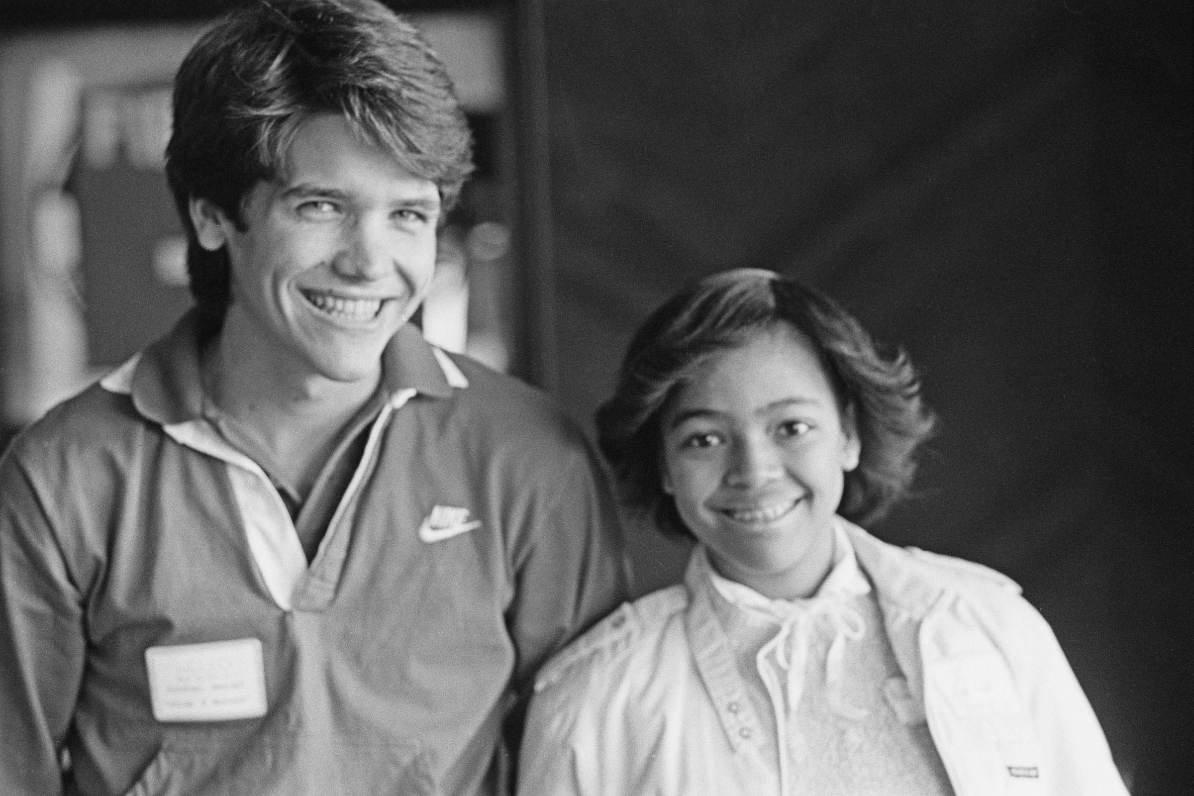 An unspecified young man with Kim Fields at the Loyola Marymount University Special Games in Los Angeles, California, on April 4, 1982 | Source: Getty Images