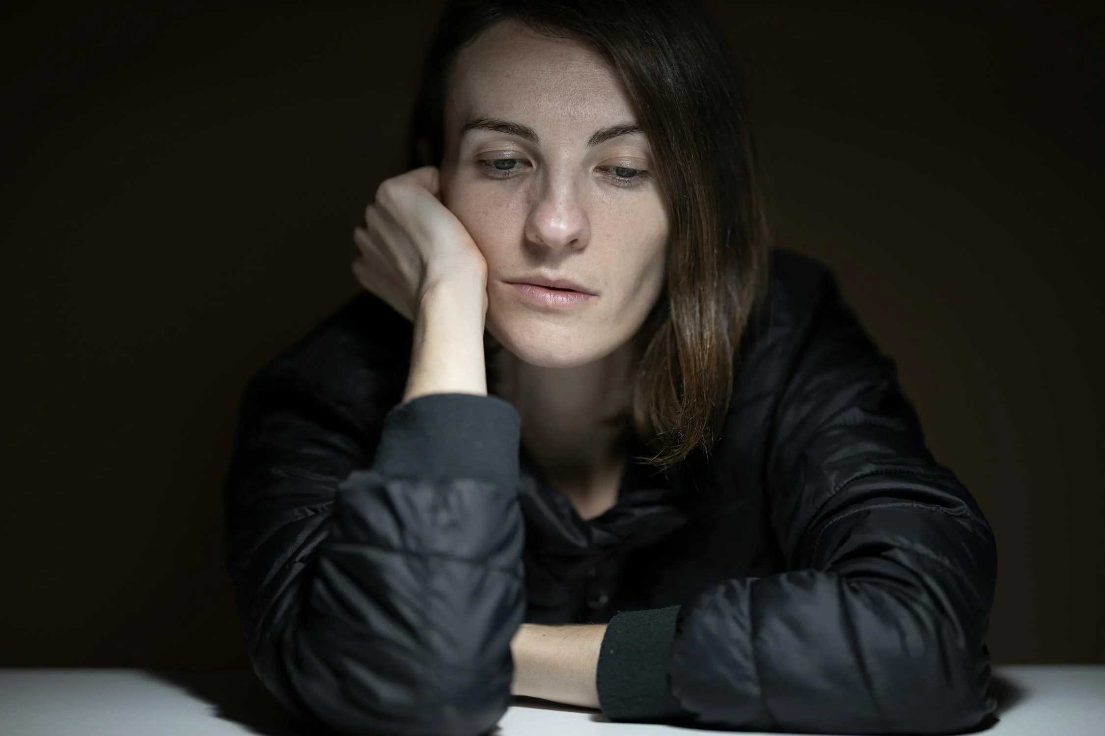 A serious woman holding her face | Source: Pexels