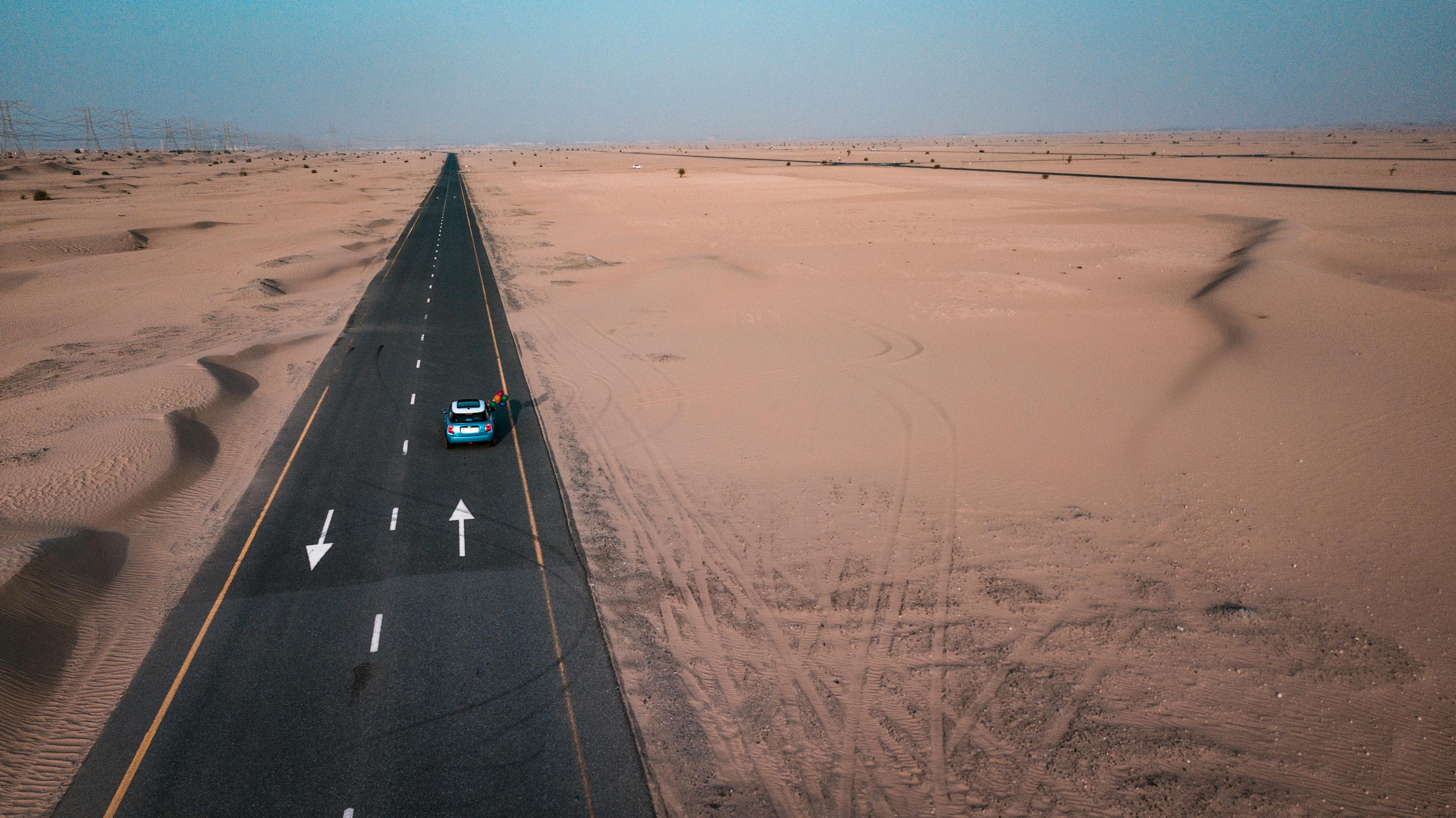 Car traveling along a remote highway | Source: Pexels