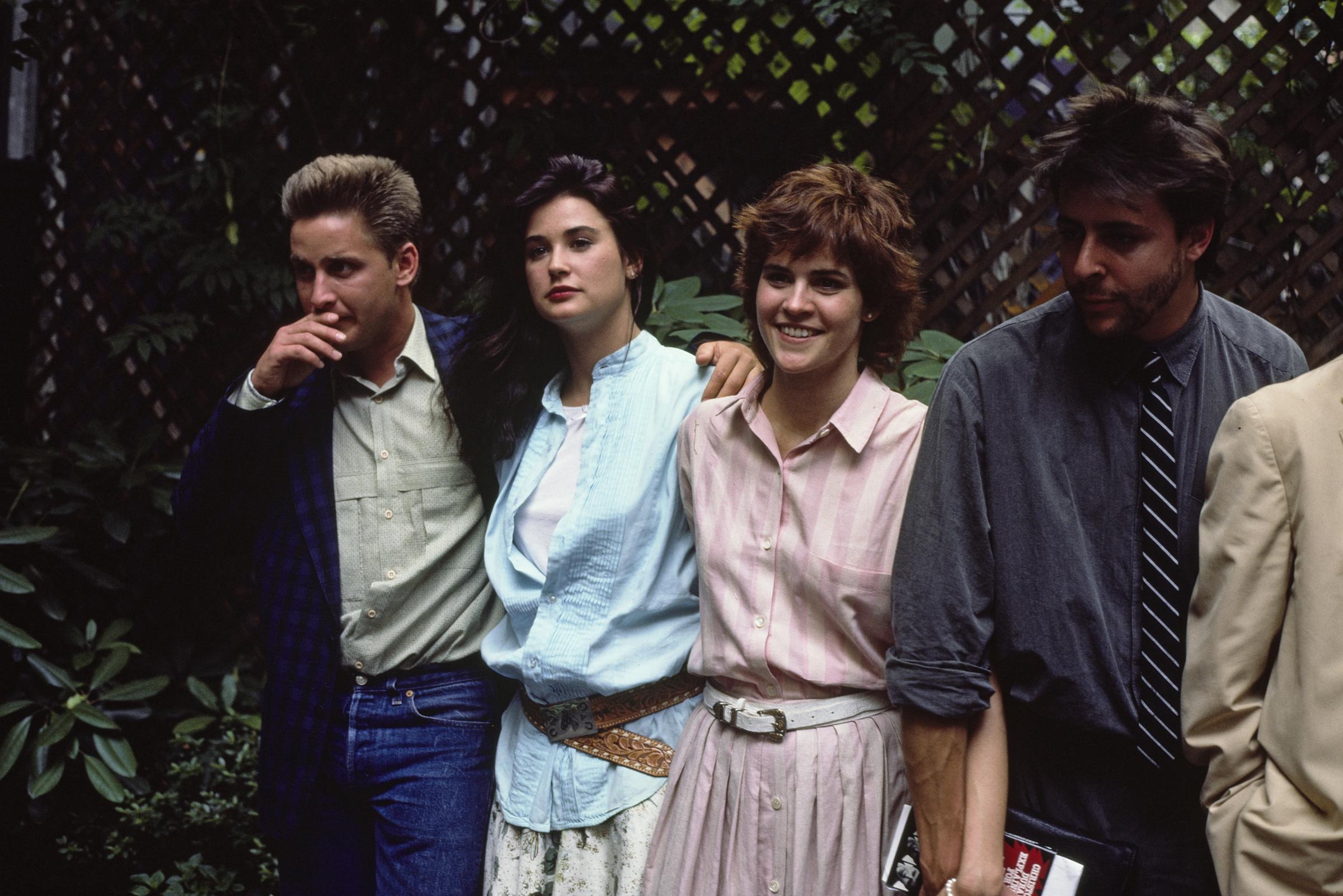Emilio Estevez, Demi Moore, the actress, and Judd Nelson pictured during a promotional event for "St Elmo's Fire" on January 1, 1985 | Source: Getty Images